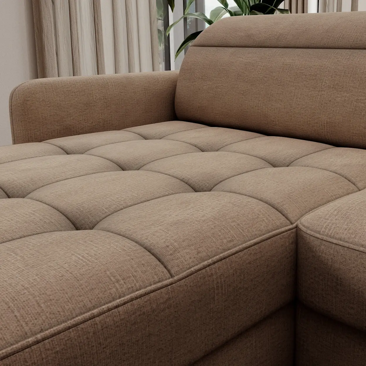 Zbliżenie na narożnik Berrto w ciepłym, beżowo-brązowym odcieniu z pikowanym siedziskiem. Widoczna jest strukturalna tapicerka, miękkie przeszycia oraz wygodne oparcie, które podkreśla przytulny charakter mebla.