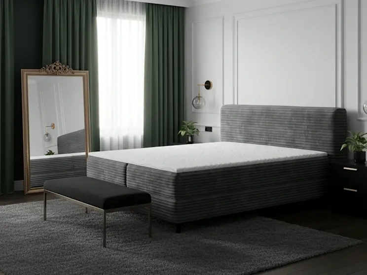 Nowoczesne wnętrze z łóżkiem Cortiko w głębokiej szarości, otoczone ciemnymi tkaninami i designerskimi lampami.