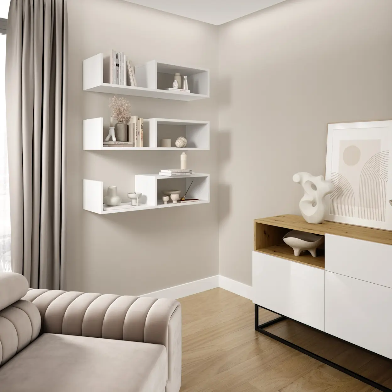 Jasny kącik wypoczynkowy w salonie z fotelą Laurence Sola 18 i białymi półkami Vellia na ścianie. Minimalistyczna aranżacja w beżach i bieli z dodatkami dekoracji oraz komodą w drewnie i bieli.