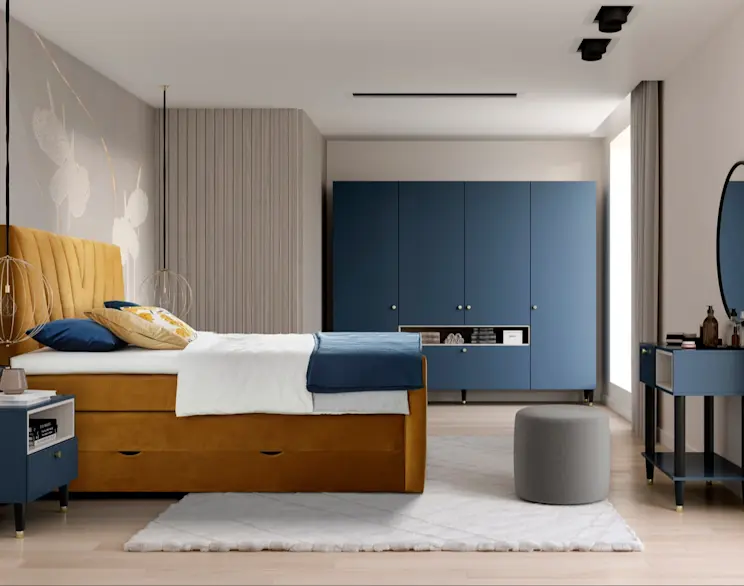 Nowoczesna sypialnia z łóżkiem kontynentalnym Candice w tkaninie Nube 45 i pojemnikiem na pościel. Obok stoi puf Linsy, a przy toaletce znajduje się lustro Grace 80 cm, które optycznie powiększa wnętrze.