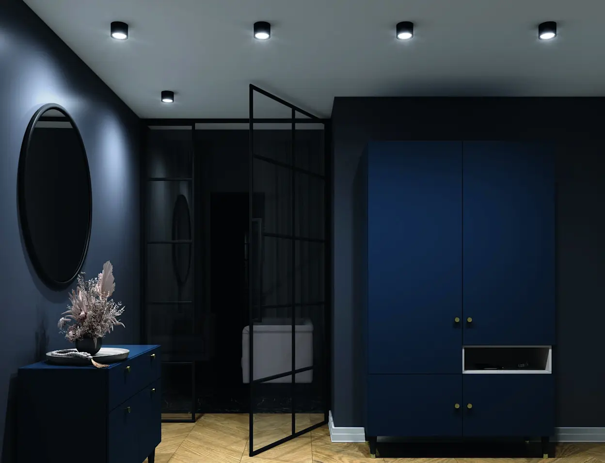 Nowoczesny przedpokój w ciemnogranatowej kolorystyce z owalnym lustrem ściennym Grace oraz spotami sufitowymi Vallum. Minimalistyczne oświetlenie podkreśla eleganckie meble i tworzy nastrojowy klimat wnętrza.