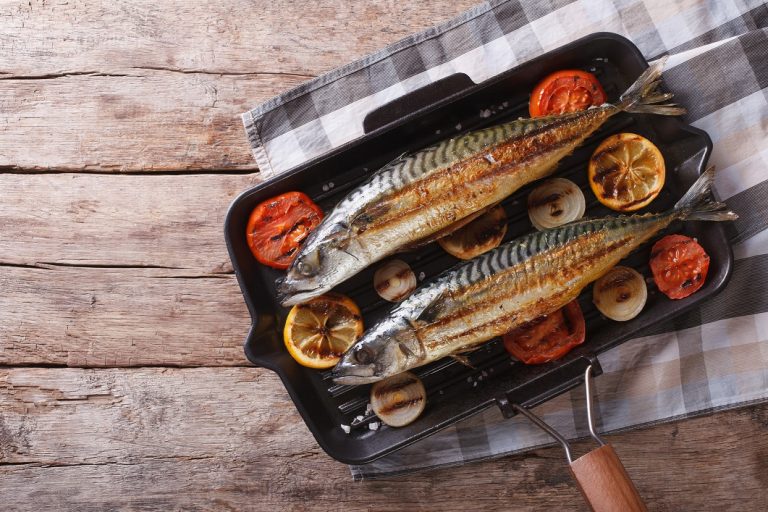 Grilled-mackerel-in-pan-with-vegetables.-horizontal-top-view-768x512