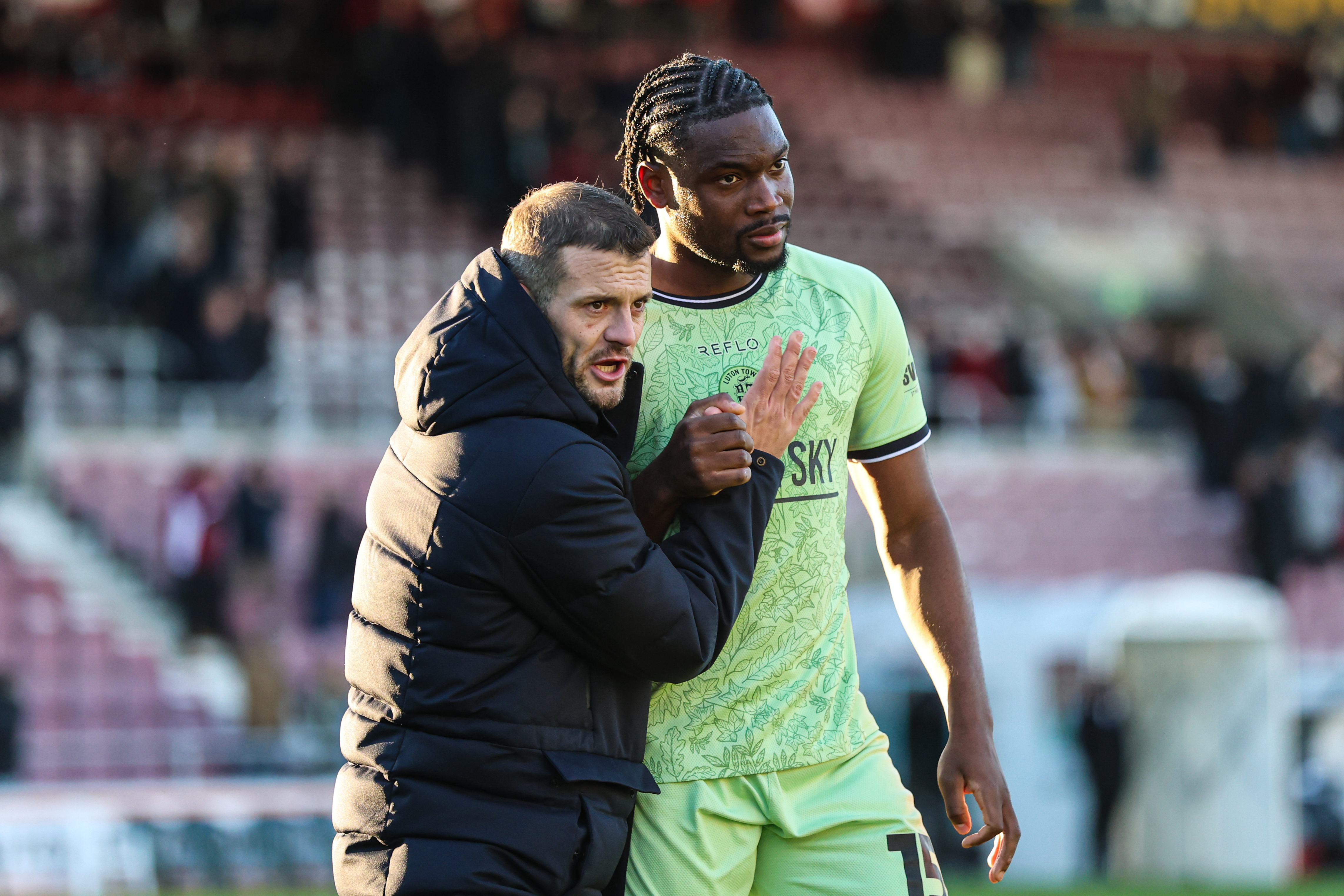 Jack Wilshere and defender Teden Mengi pictured at the end of the Northampton win