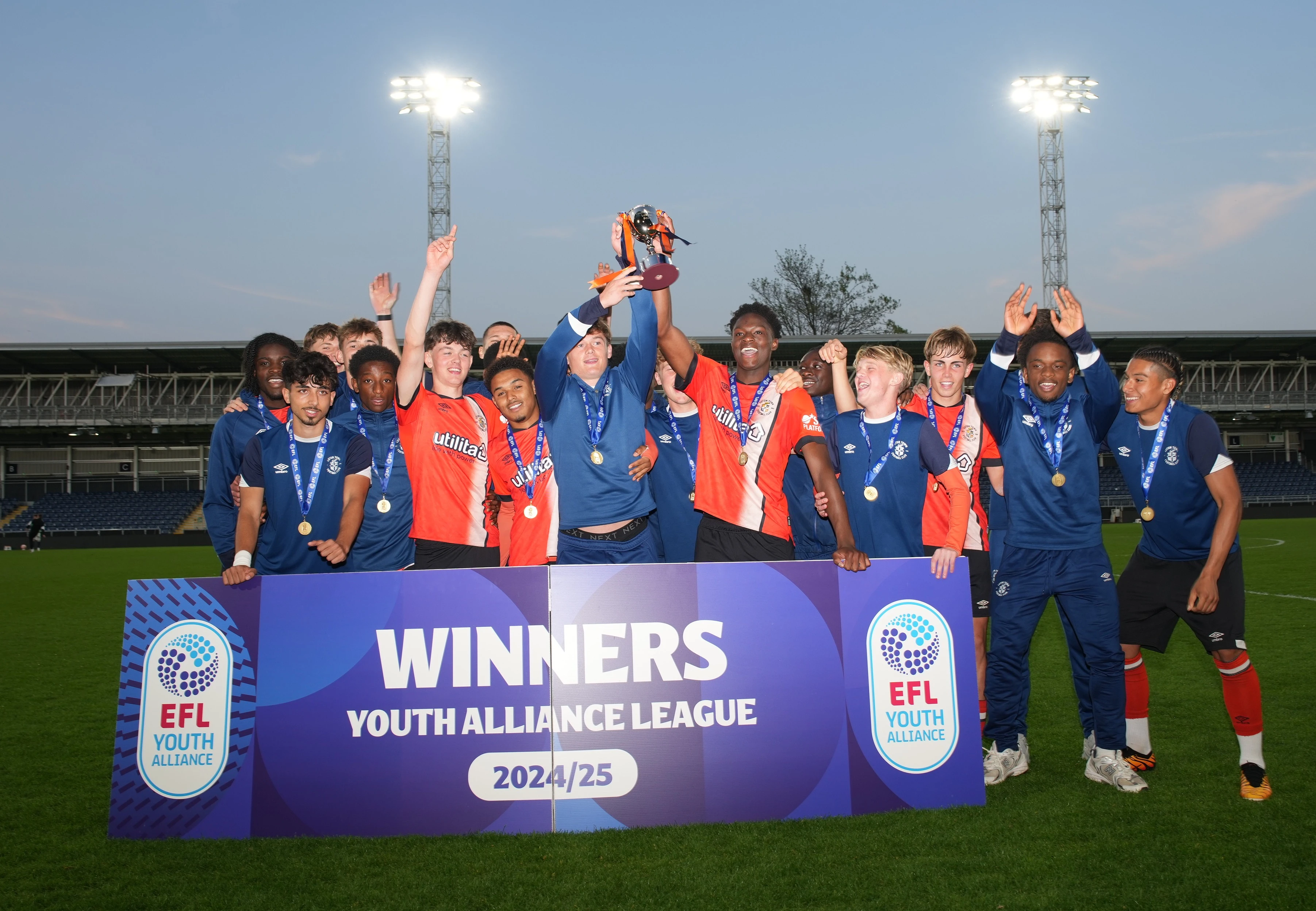 The Luton Town Under-18 squad lift the EFL Youth Alliance South Division trophy at half-time of the Under-21s' 2-2 draw with Oxford at Kenilworth Road.