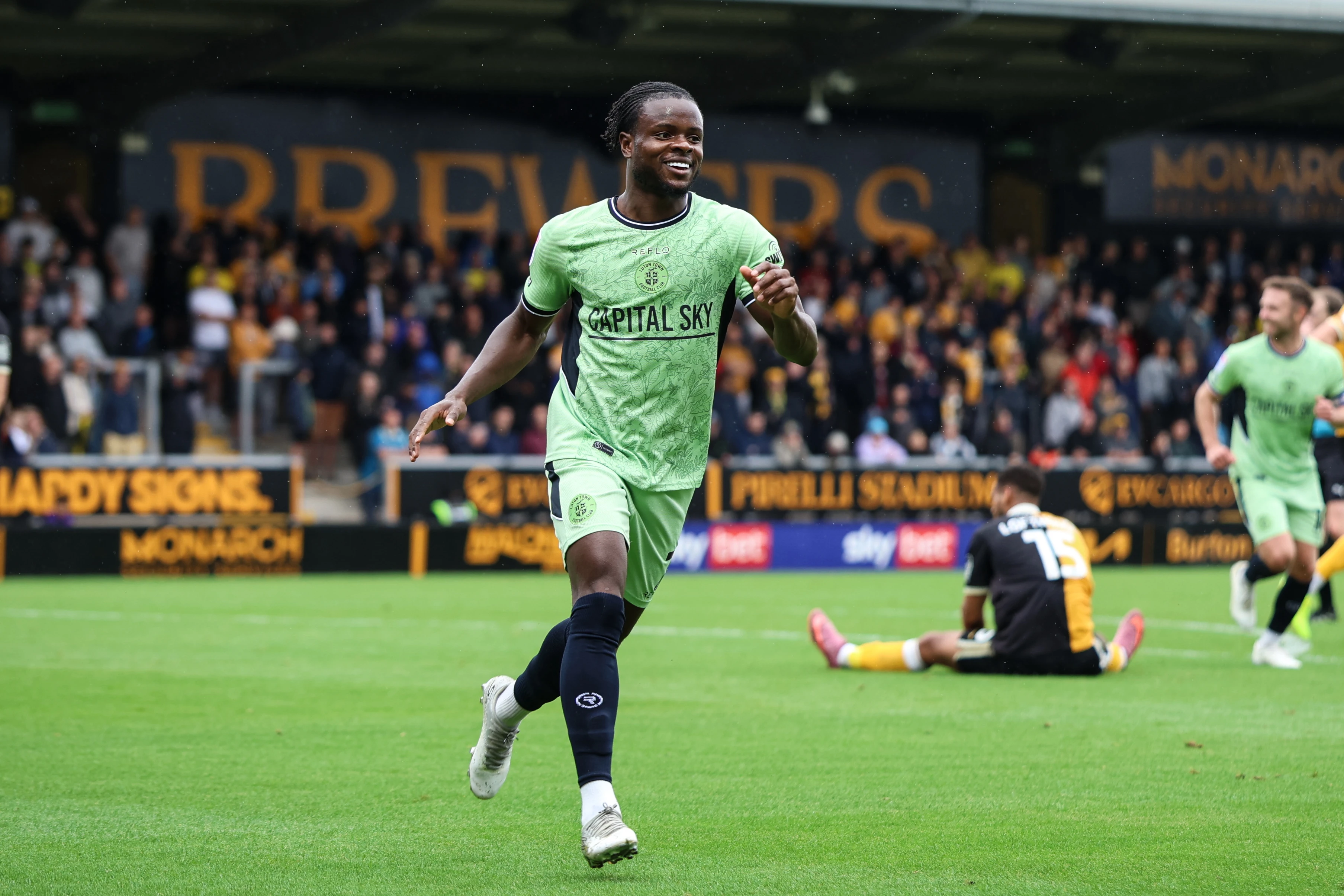 Milli Alli is all smiles after neting his first goal of the season at Burton.