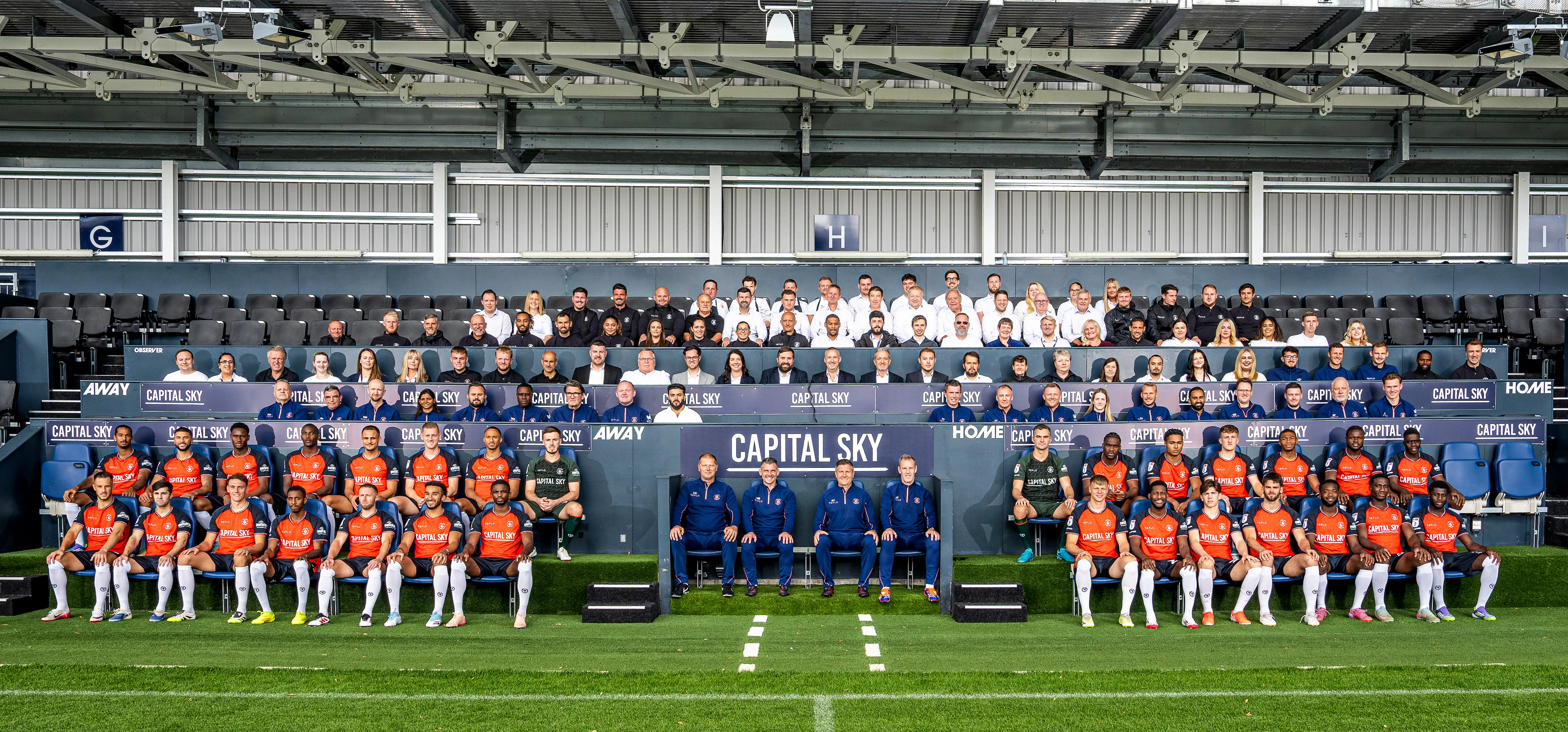 The coaches, players and Luton Town club staff take part in the first all-club photo since 2014.