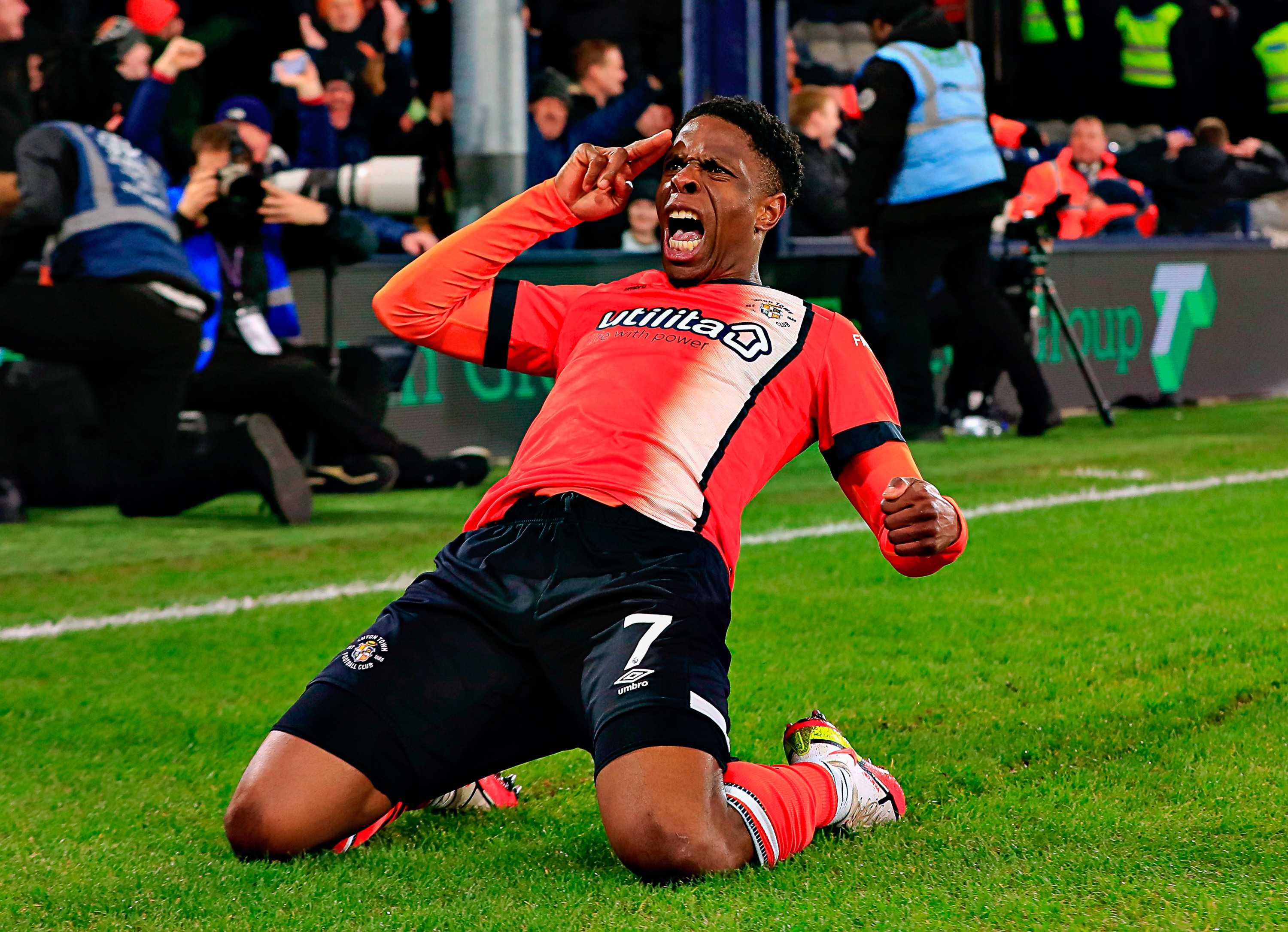 Chieo Ogbene celebrates his goal in the 4-0 win over Brighton at Kenilworth Road