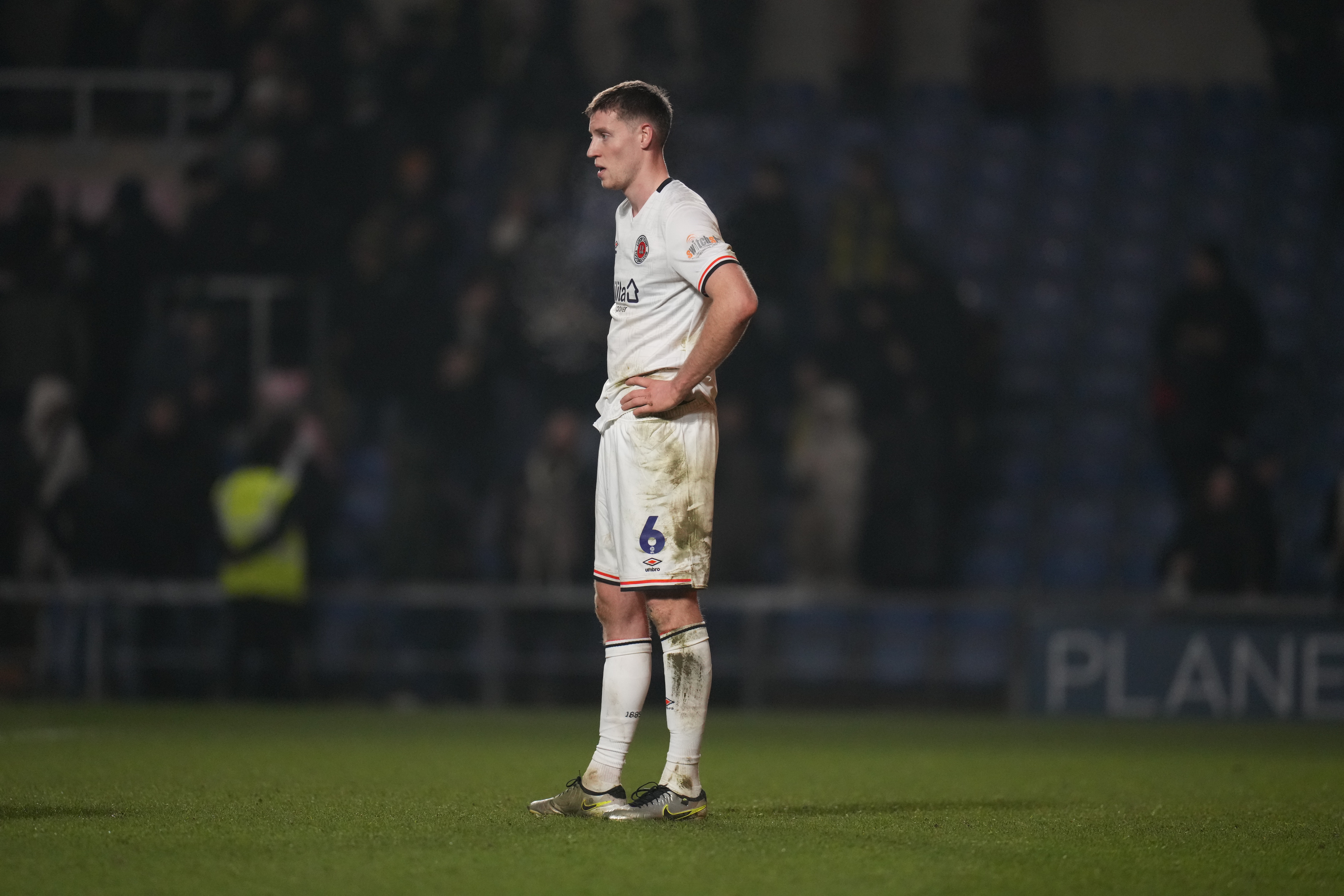 Mark McGuinness with his hands on his hips.