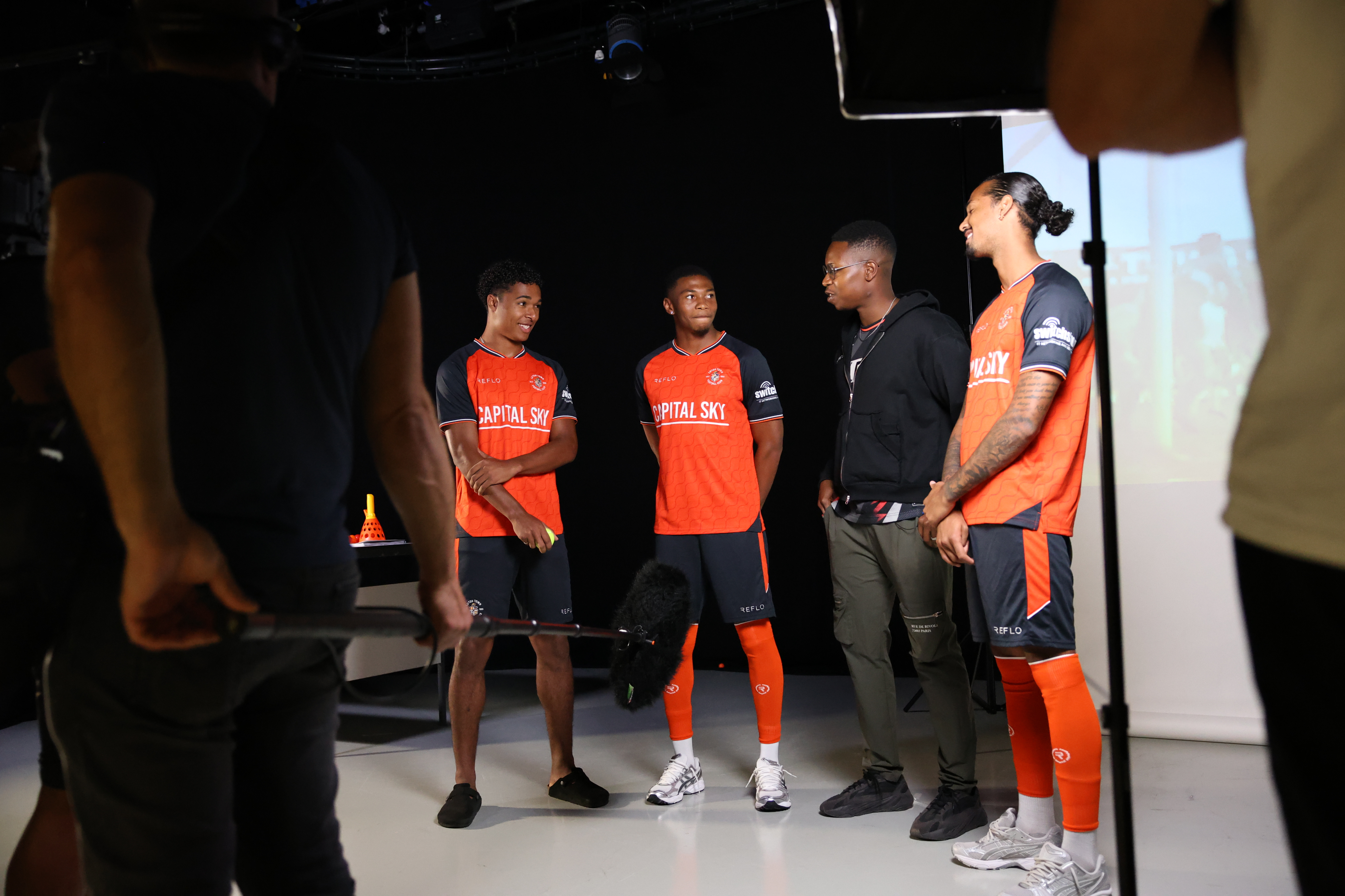 Sky Sports reporter Sam Obaseki chats with Reuell Walters, Zack Nelson and Nigel Lonwijk at the Luton Town 2025/26 content day