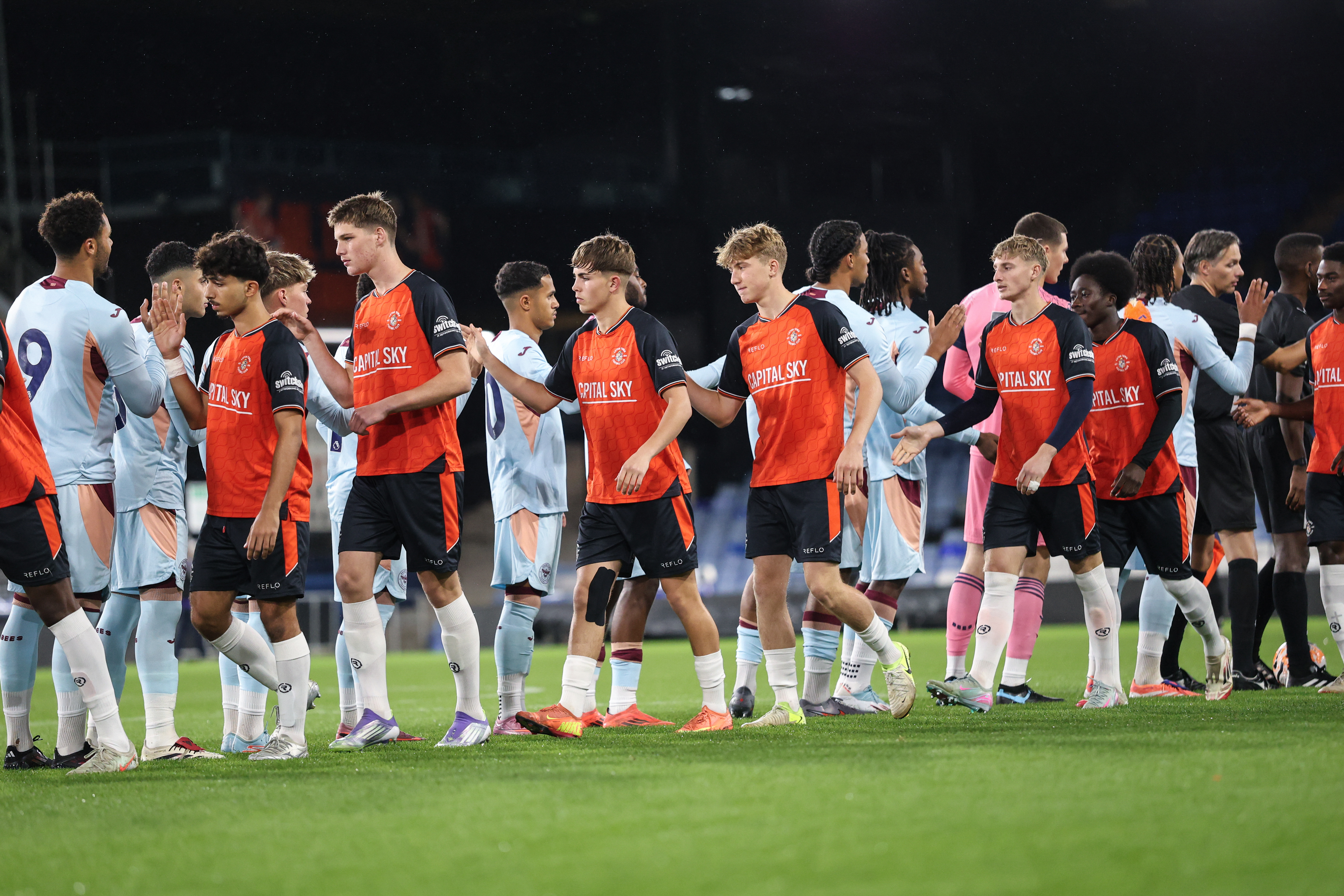 The Hatters Under-21s shake hands with their Brentford counterparts before the Premier League Cup game at Kenilworth Road.