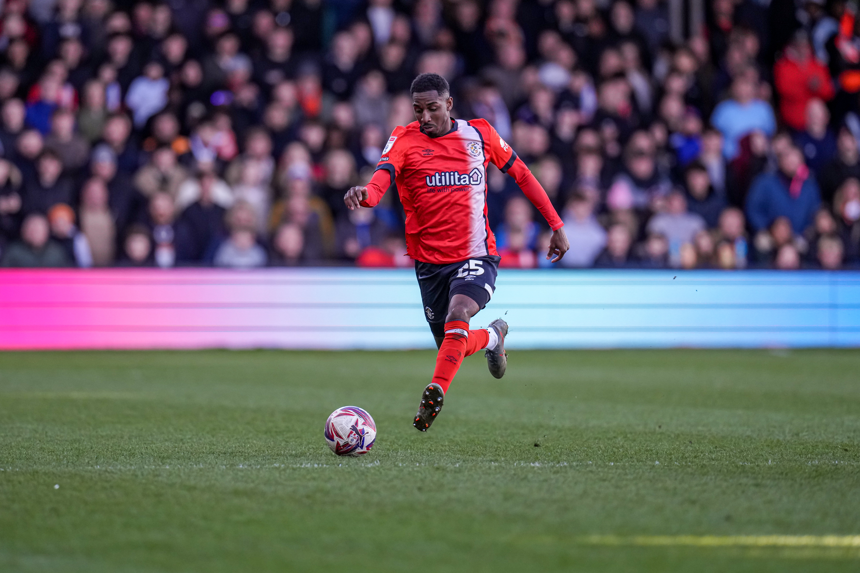 Izzy Jones in action against his former club Middlesbrough at Kenilworth Road