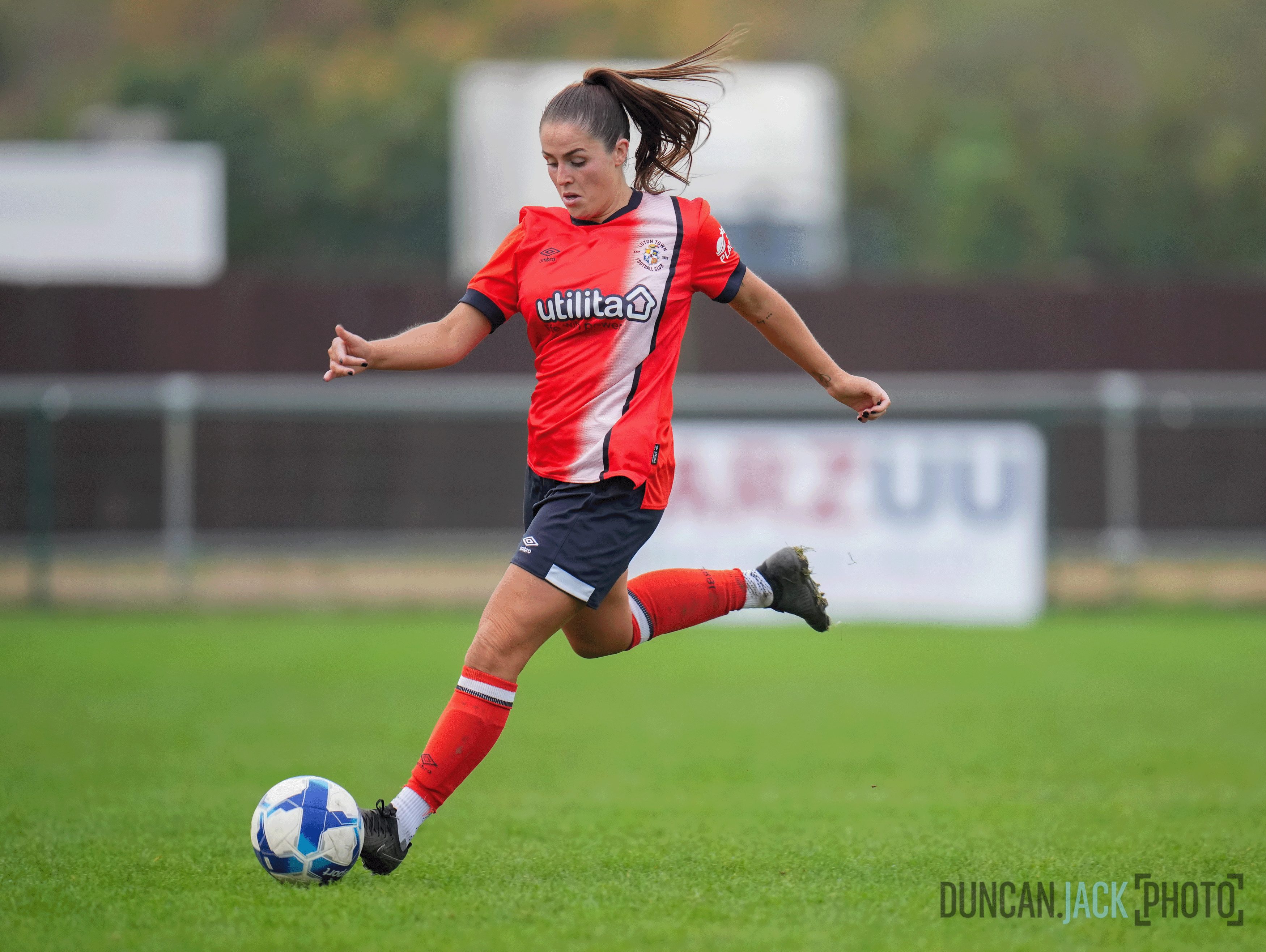 Jess McKay kicking the ball.
