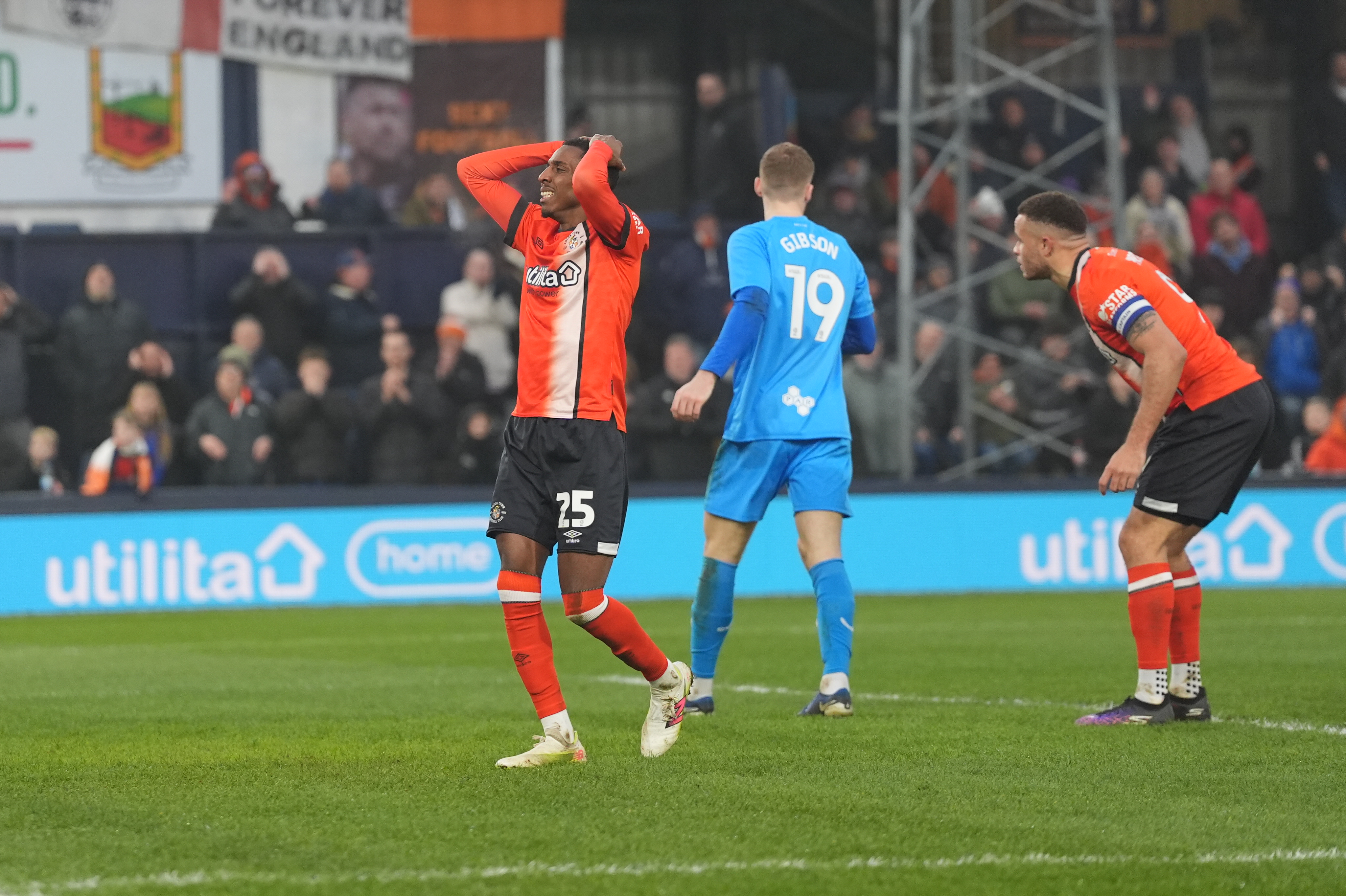 Isaiah Jones with his hands on his head.