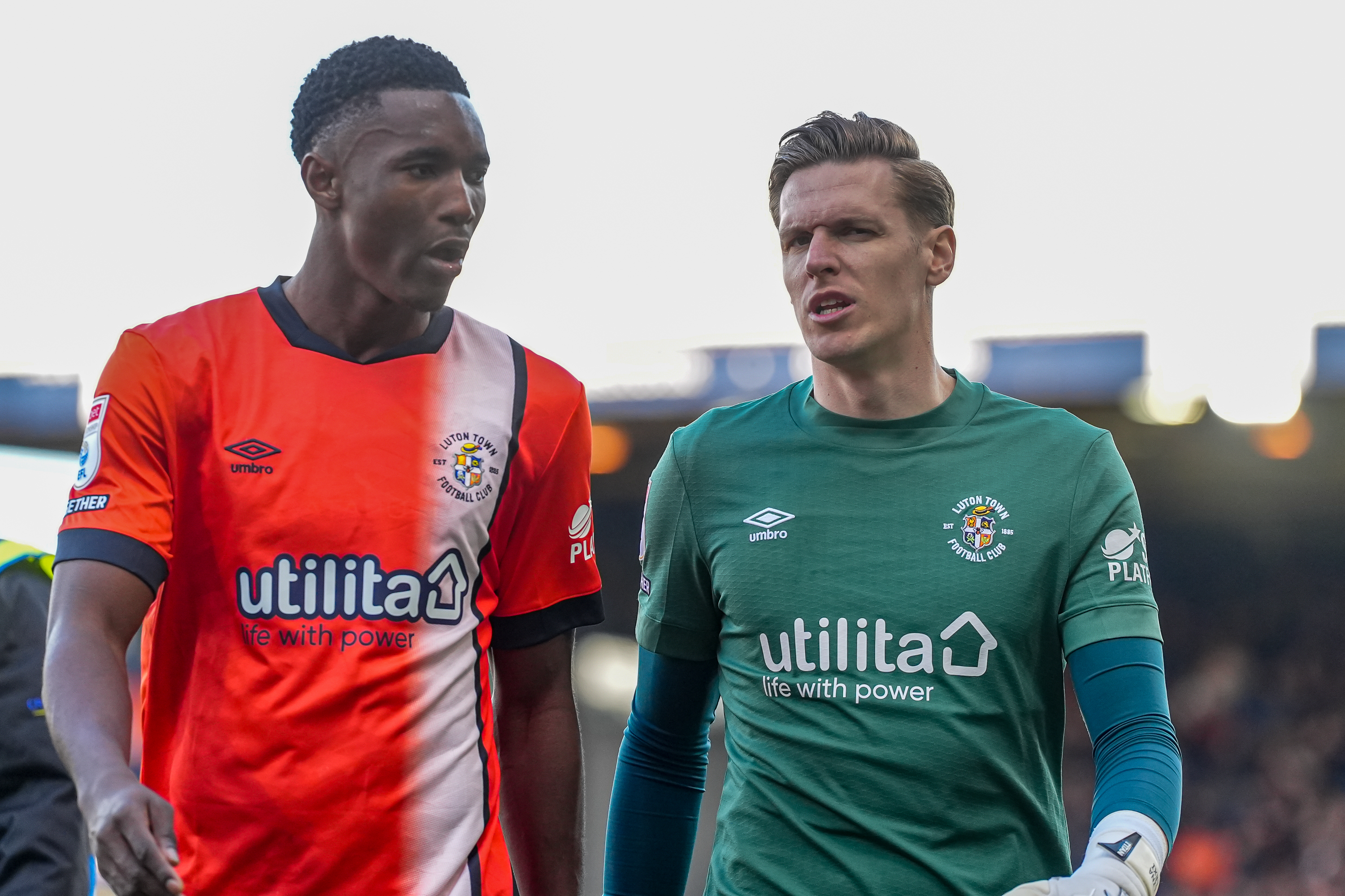 Christ Makosso and Thomas Kaminski in conversation as they walk off the Kenilworth Road pitch at half-time of the goalless draw with Middlesbrough.