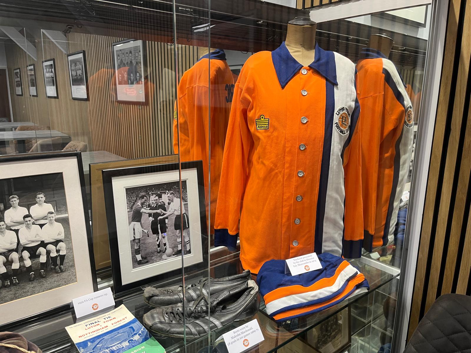 An old Luton Town shirt and other historical memorabilia on display in the Eric Morecambe Lounge at Kenilworth Road.