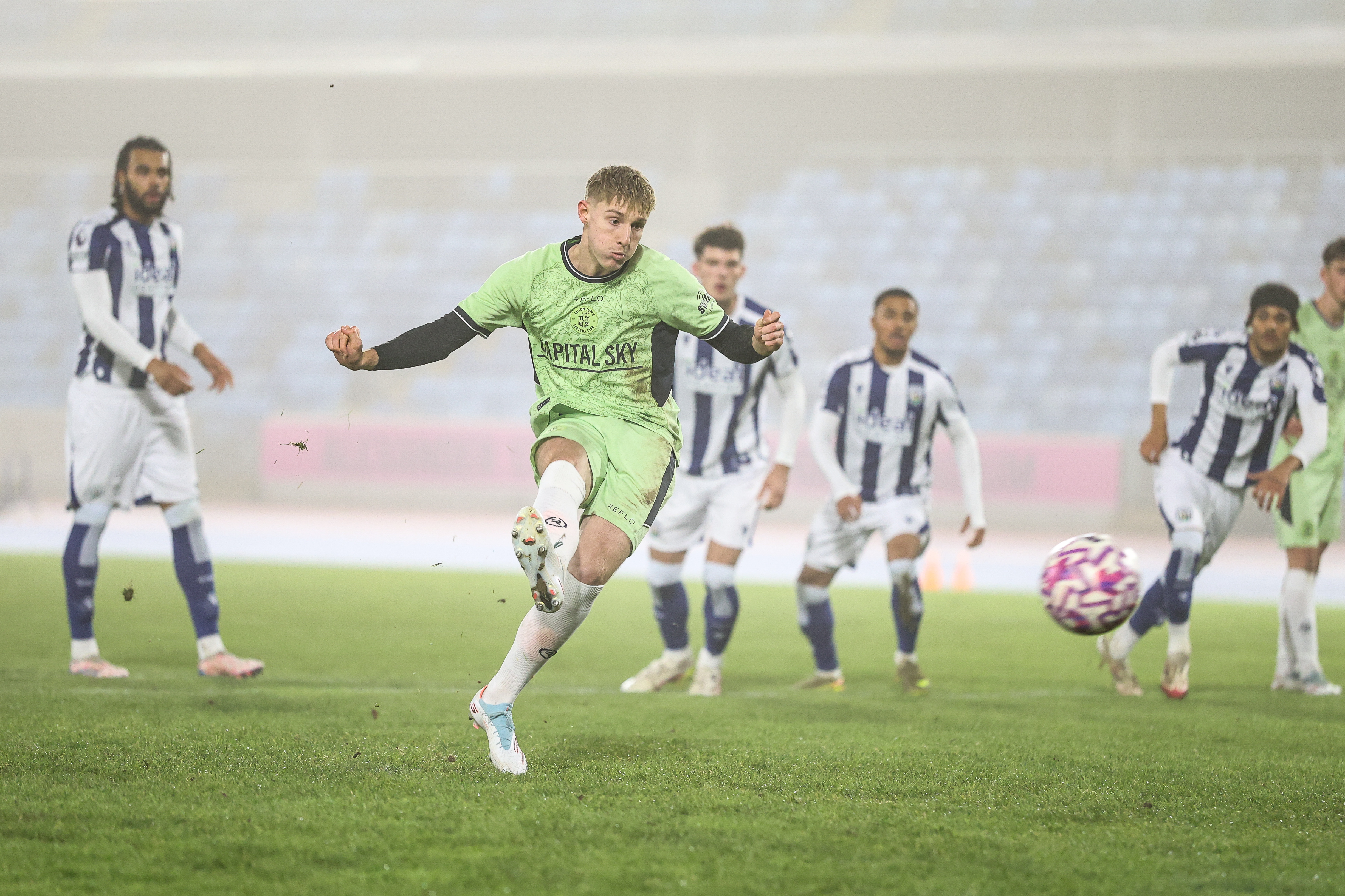 Jack Lorentzen-Jones scores his penalty in the Premier League Cup tie away to West Brom