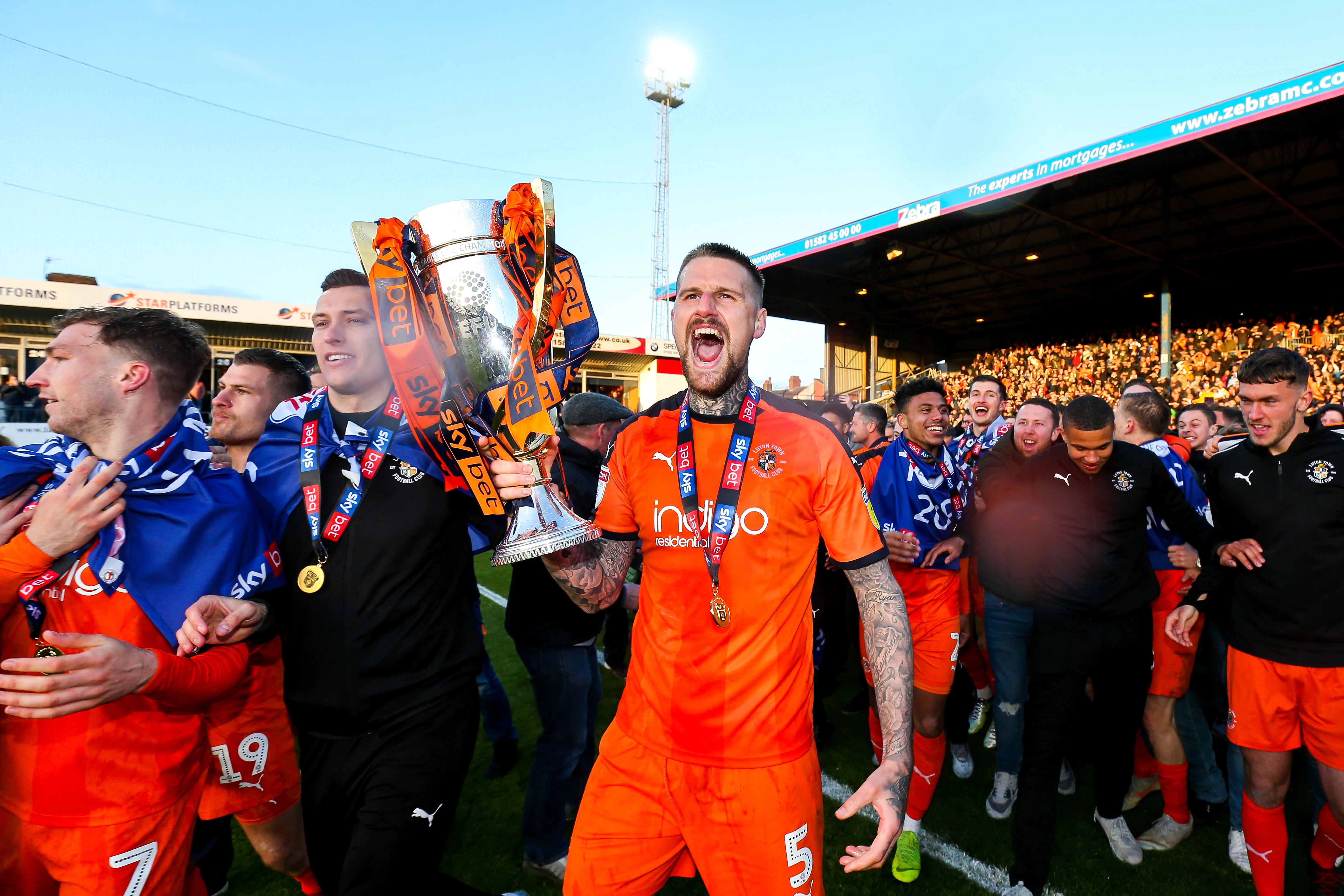 Sonny Bradley holding the League One trophy.