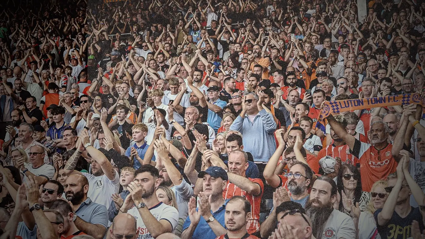 Luton Town supporters applaud at Kenilworth Road