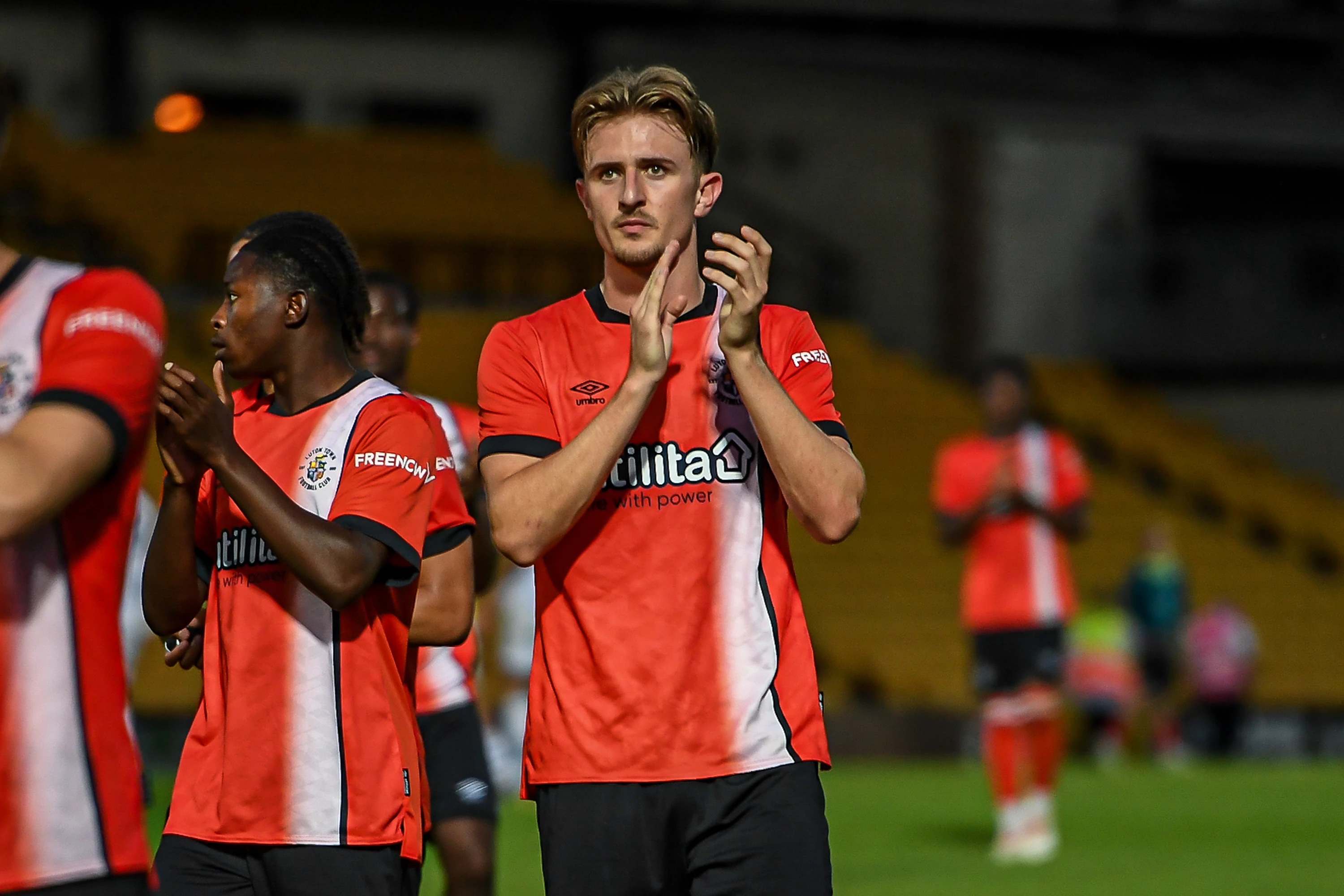 Jack Bateson applauds the travelling fans at the pre-season friendly against Port Vale