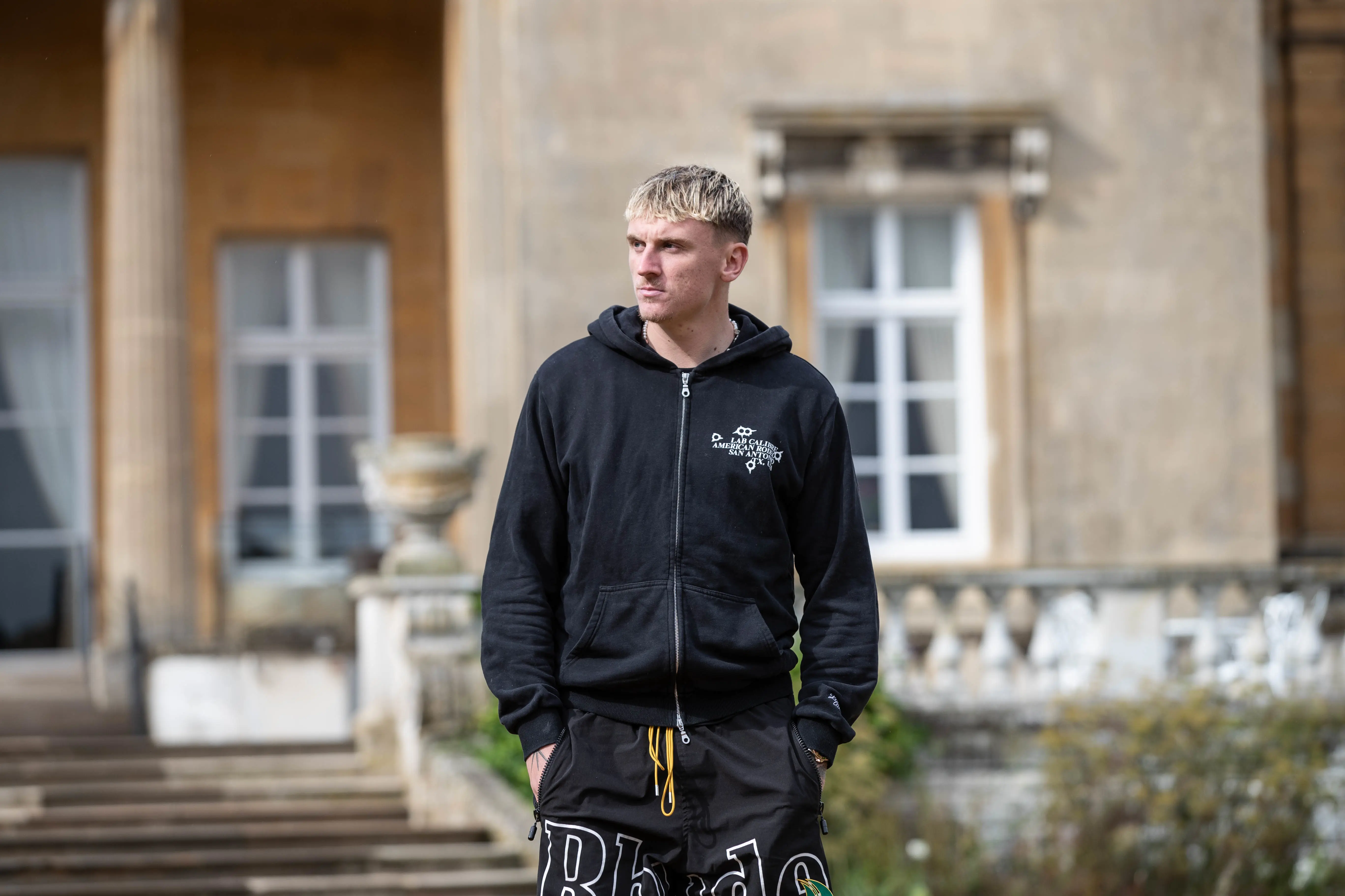 Alfie Doughty pictured in casual clothes in the grounds of Luton Hoo hotel