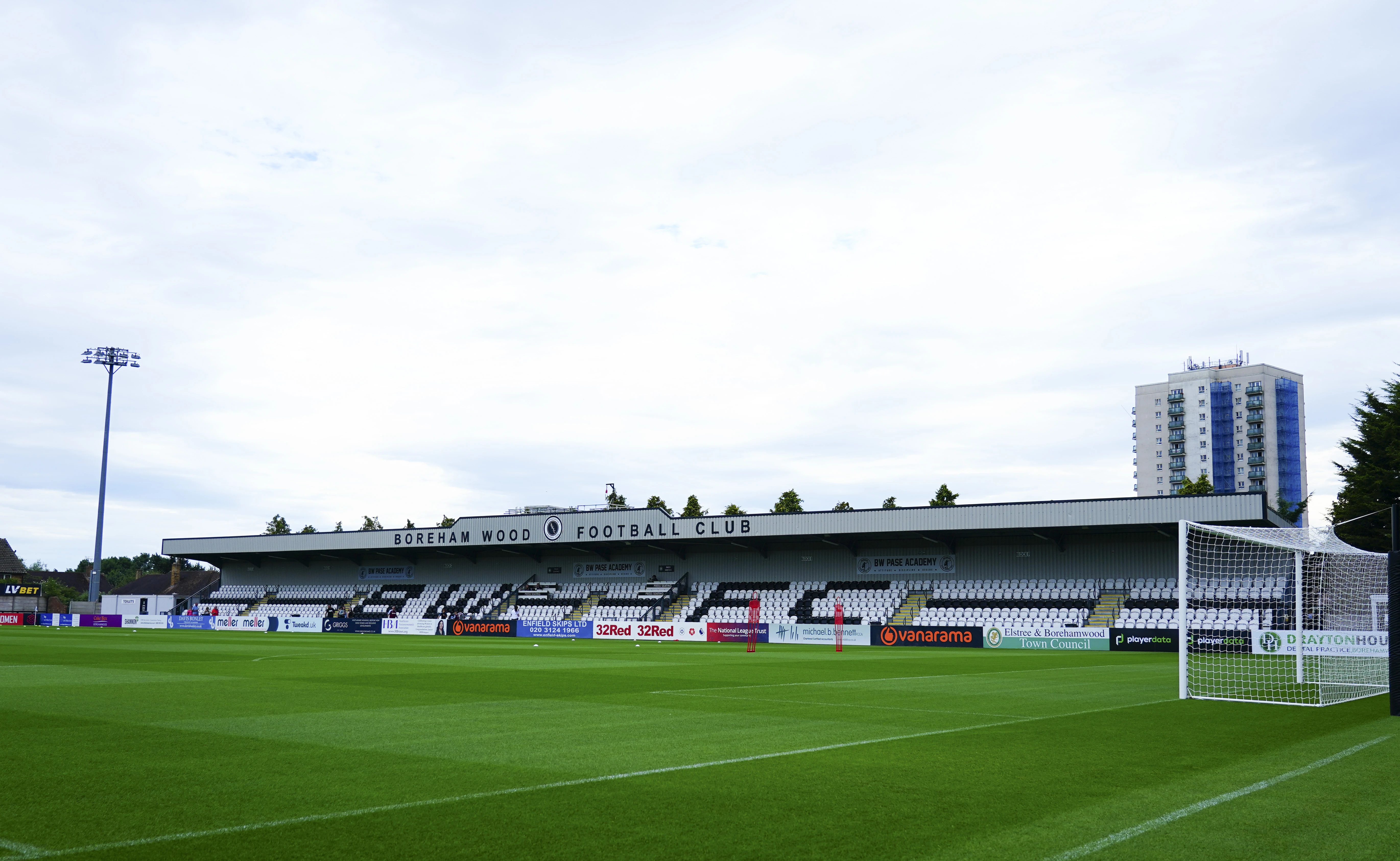 A general view across the pitch of the Boreham Wood main stand at Meadow Park.