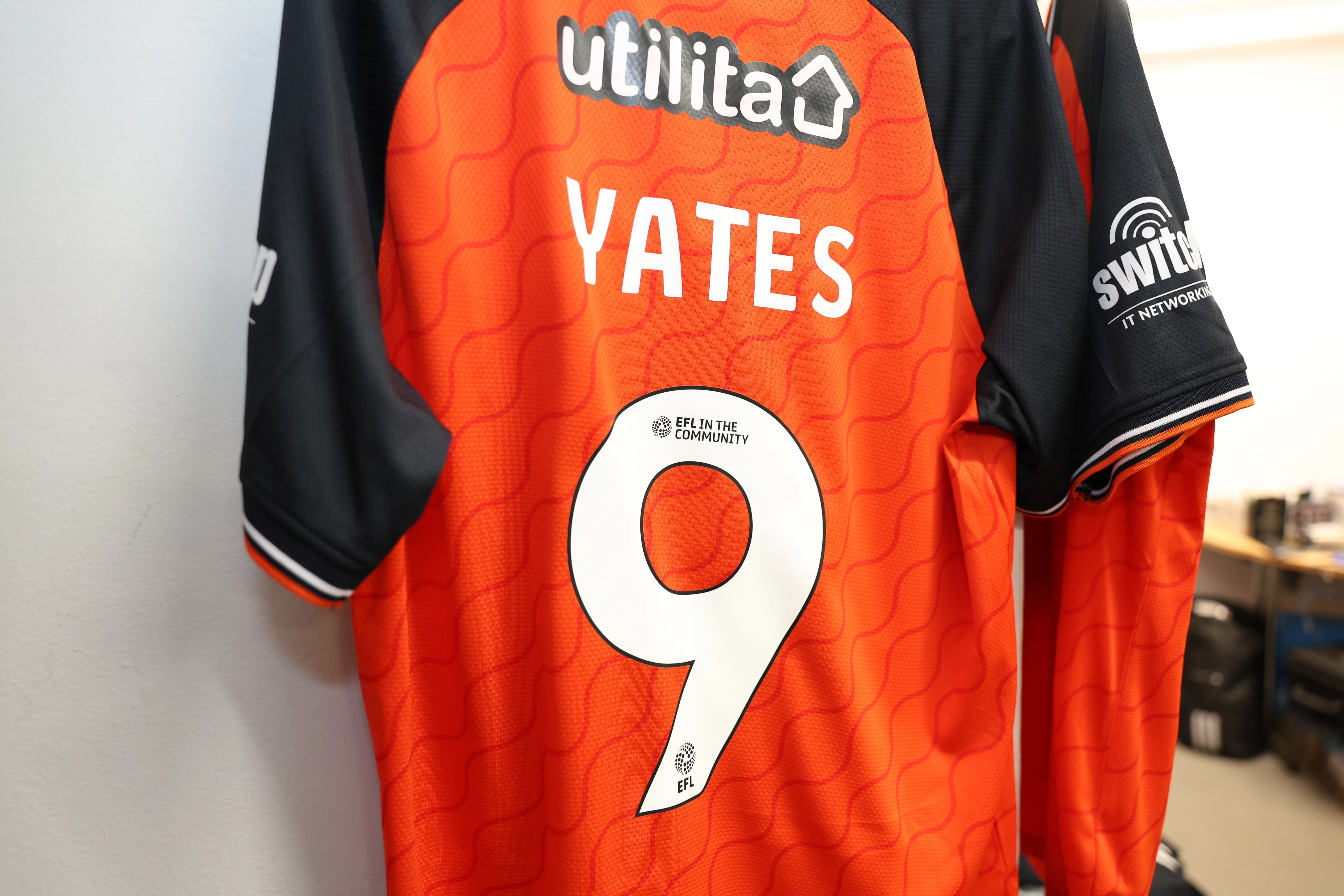 Jerry Yates' number nine shirt hangs in the away changing room at London Road.