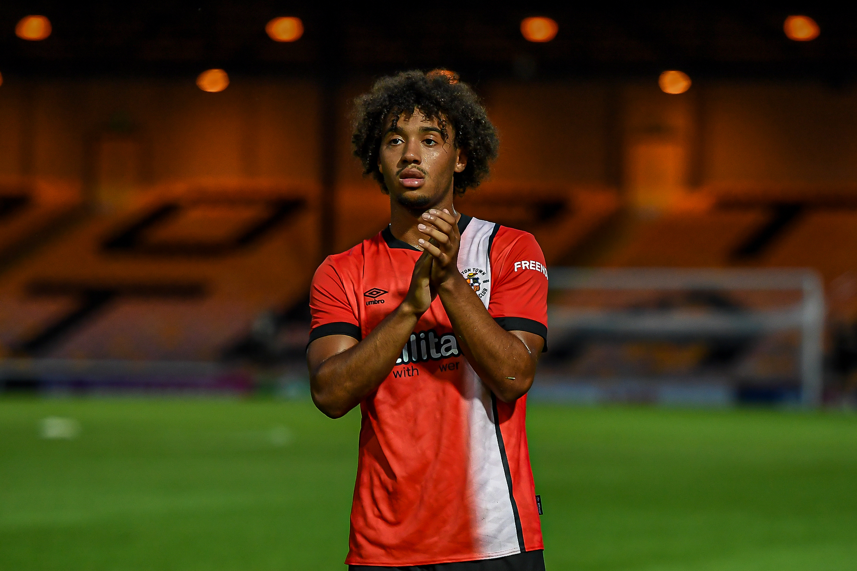 Aidan Francis-Clarke applauds the travelling fans at the end of the pre-season friendly at Port Vale in July 2024.