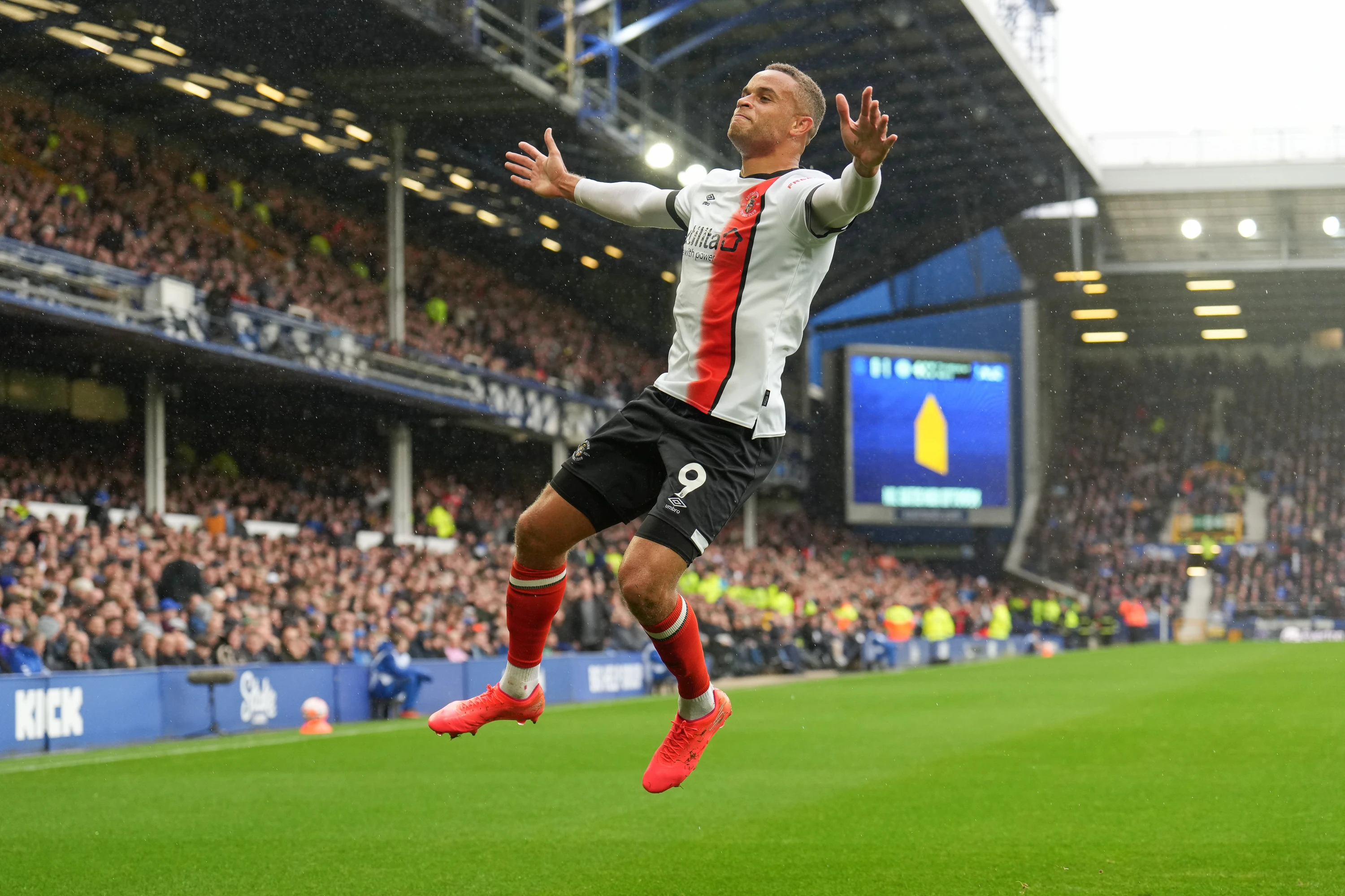 Carlton Morris leaps in the air to celebrate his winning goal in the Hatters' first-ever Premier League victory at Everton in September 2024.