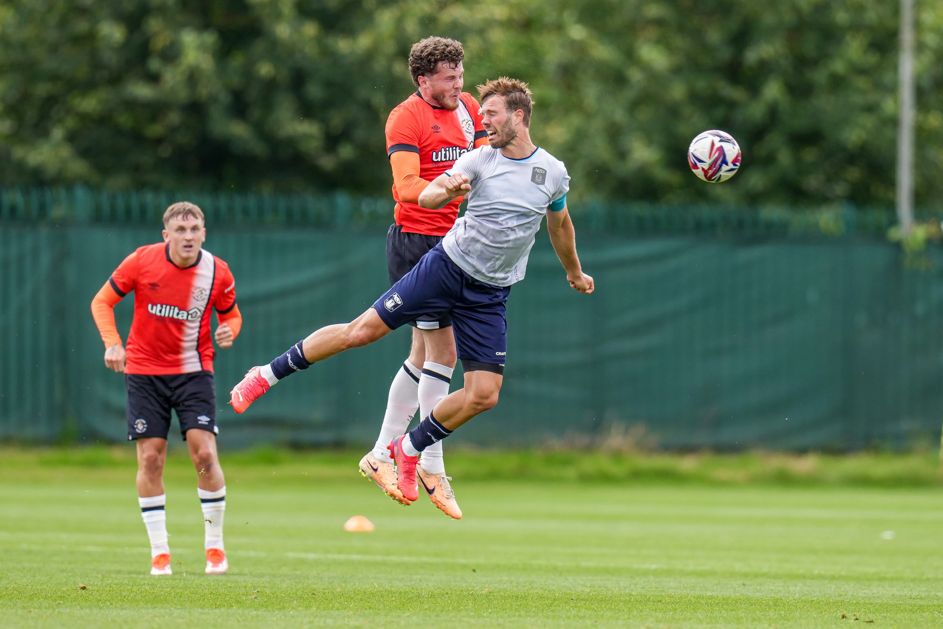 Tom Holmes wins a header in his first appearance in a Luton shirt against AGF