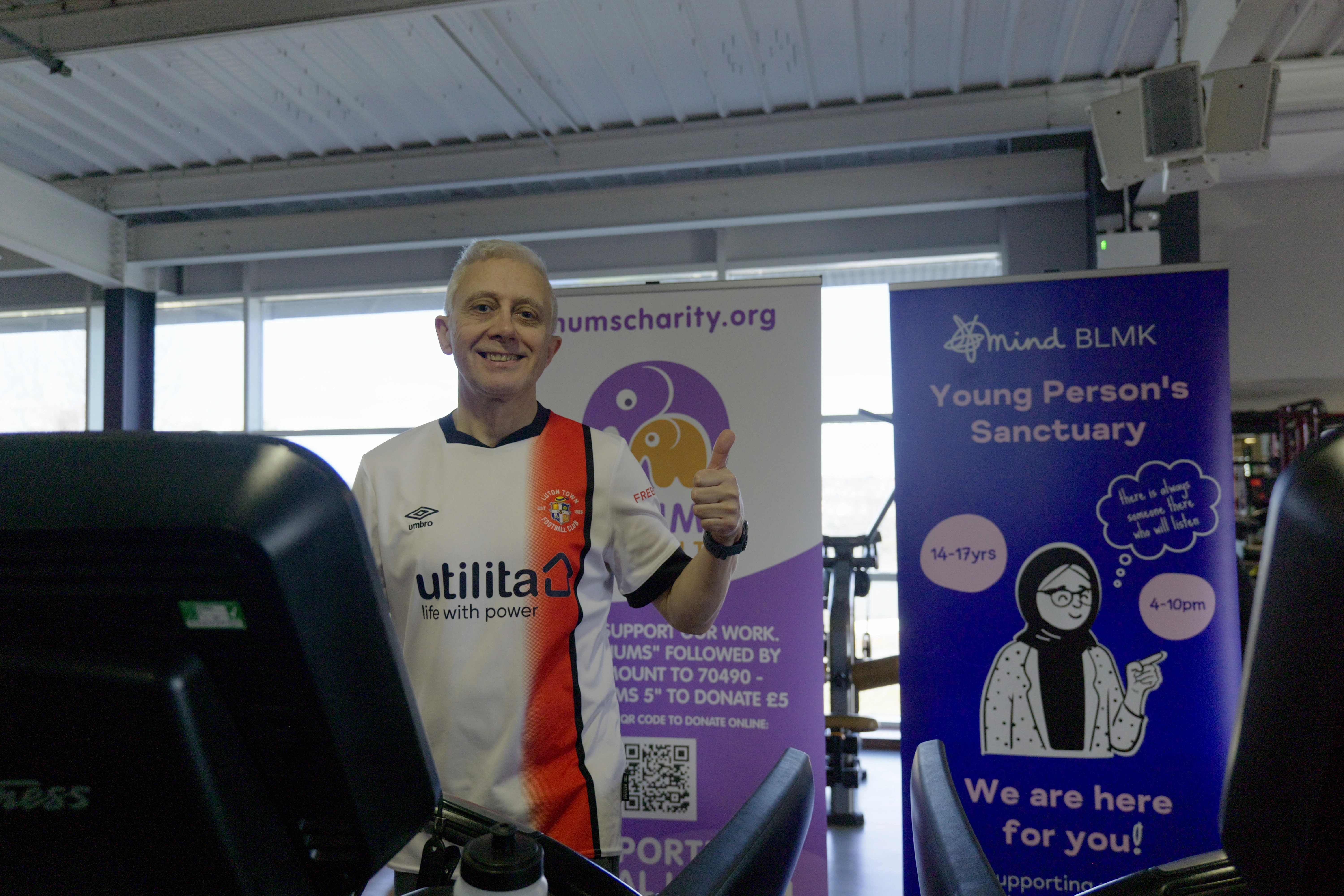 Hatters supporter Mark Crowther walking his virtual miles on a treadmill at David Lloyd gym in Capability Green, Luton