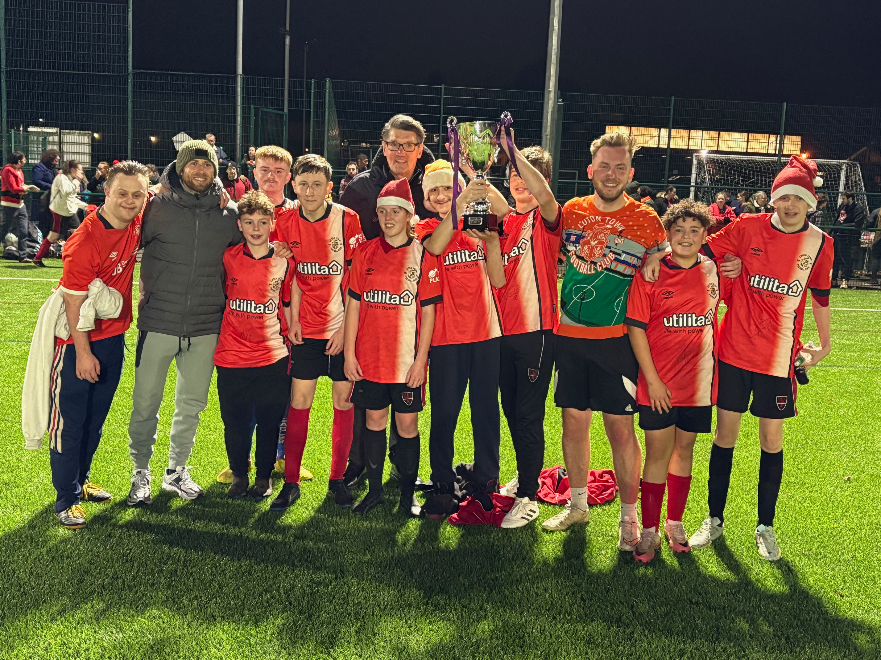 Jordan Clark and Mick Harford with the winning team at the SEND after-school football session at Redborne Upper School in Ampthill