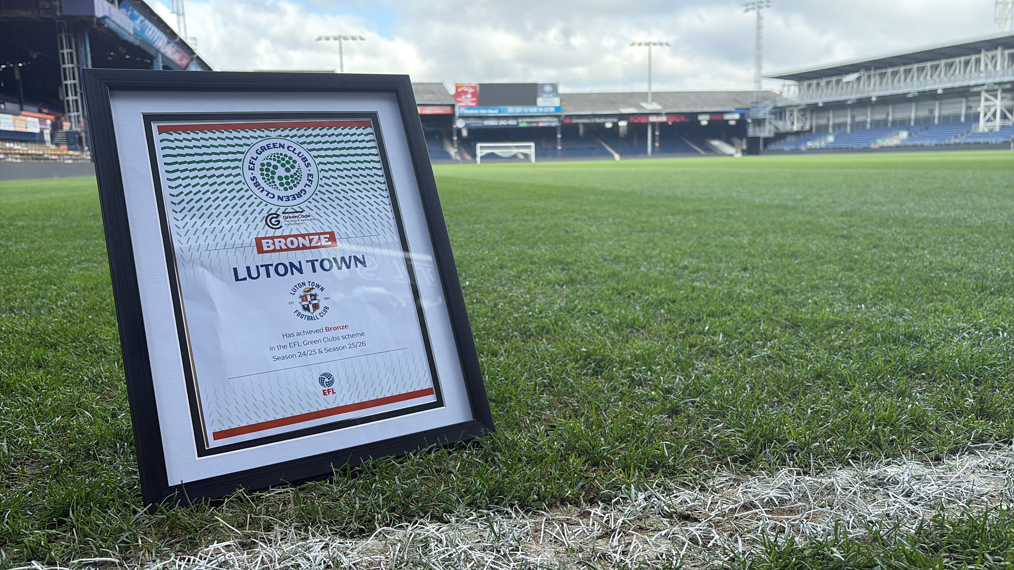 The Hatters' EFL Green Clubs Bronze Award on the pitch at Kenilworth Road.
