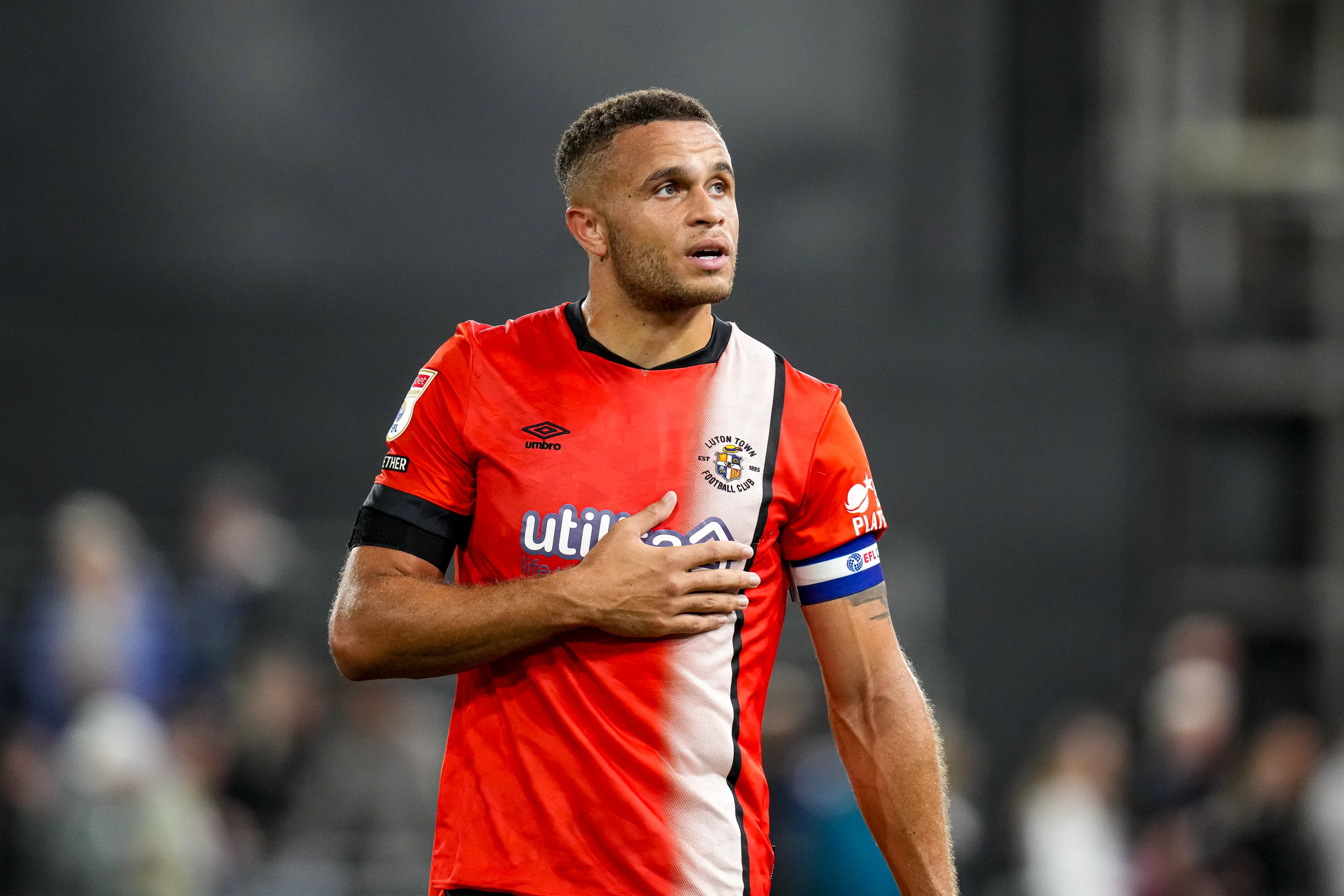 Carlton Morris pictured as the players do a lap of the pitch after the game against QPR