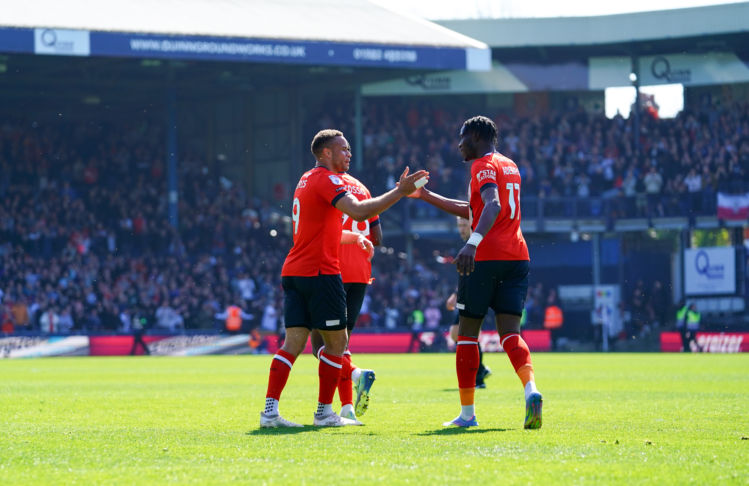 Carlton Morris congratulates Elijah Adebayo on his role in the Town's opening goal against Leeds United at Kenilworth Road.