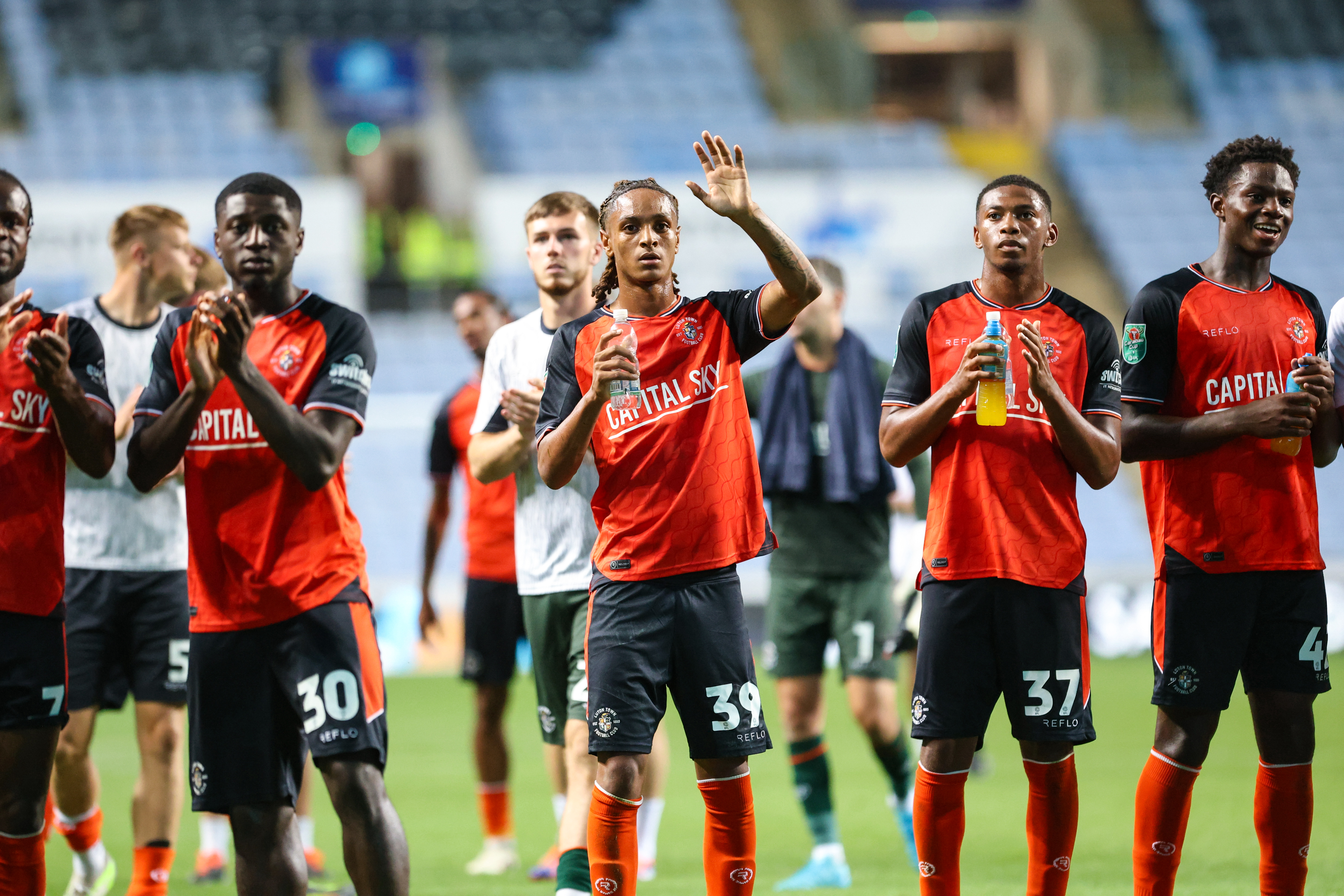 Joshua Phillips waving to the Luton fans at Coventry.