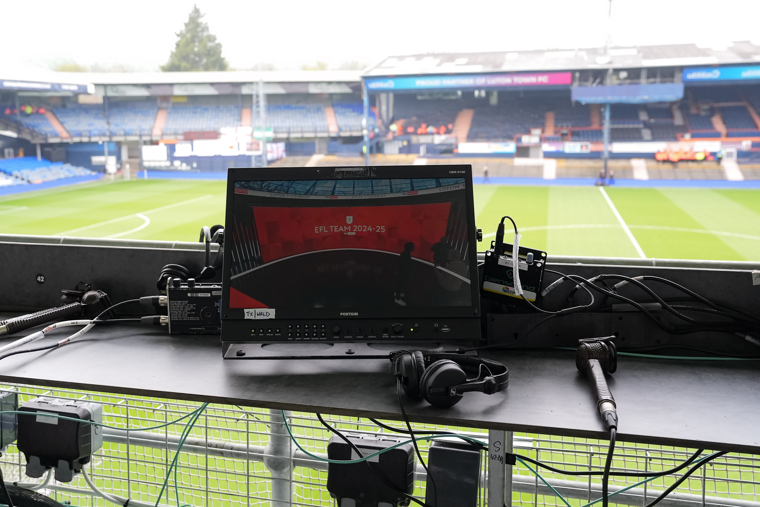 A broadcast screen in the Bobbers gantry at Kenilworth Road.