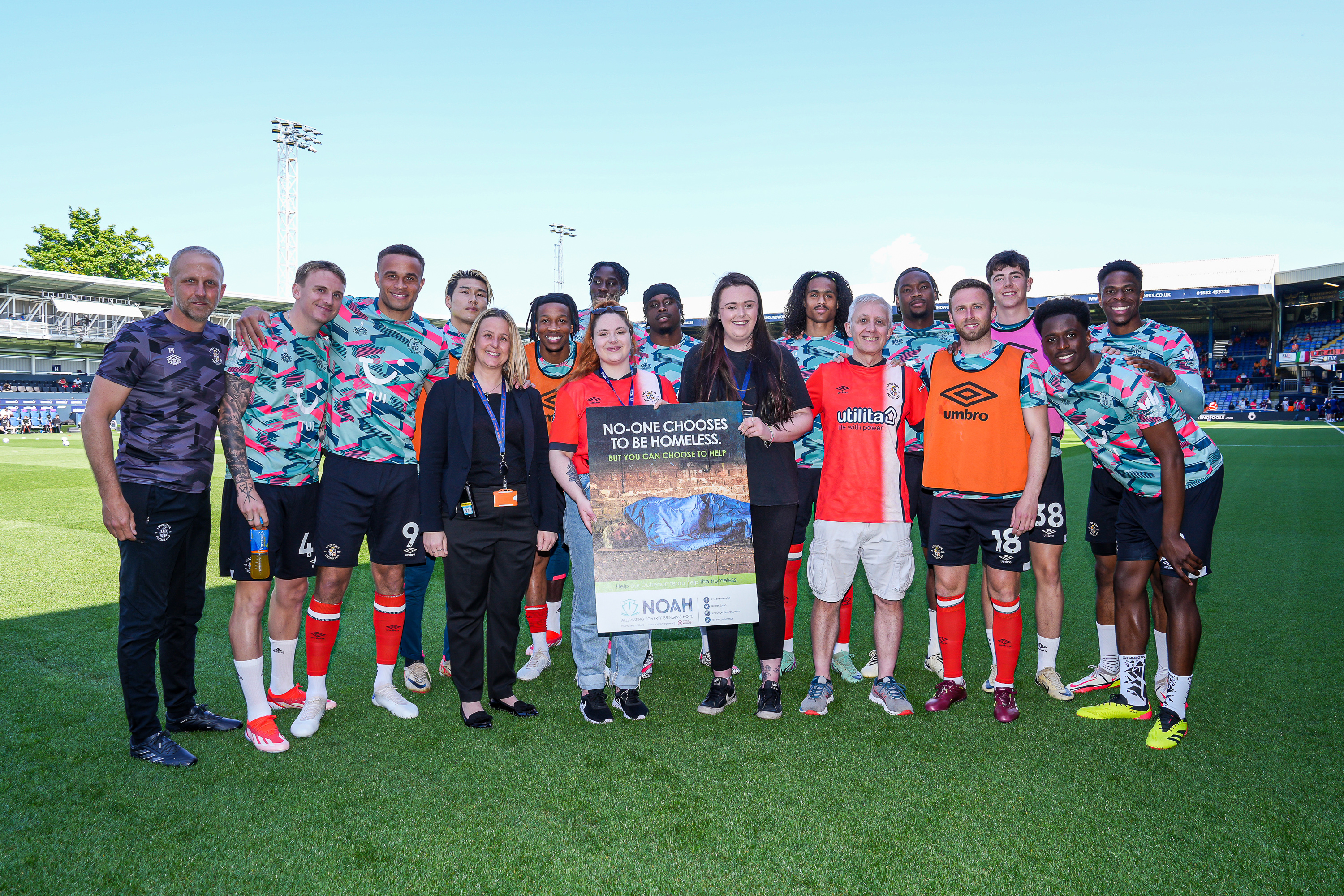 Club Charity of the Year NOAH on pitch presentation with the Luton Town squad and staff.