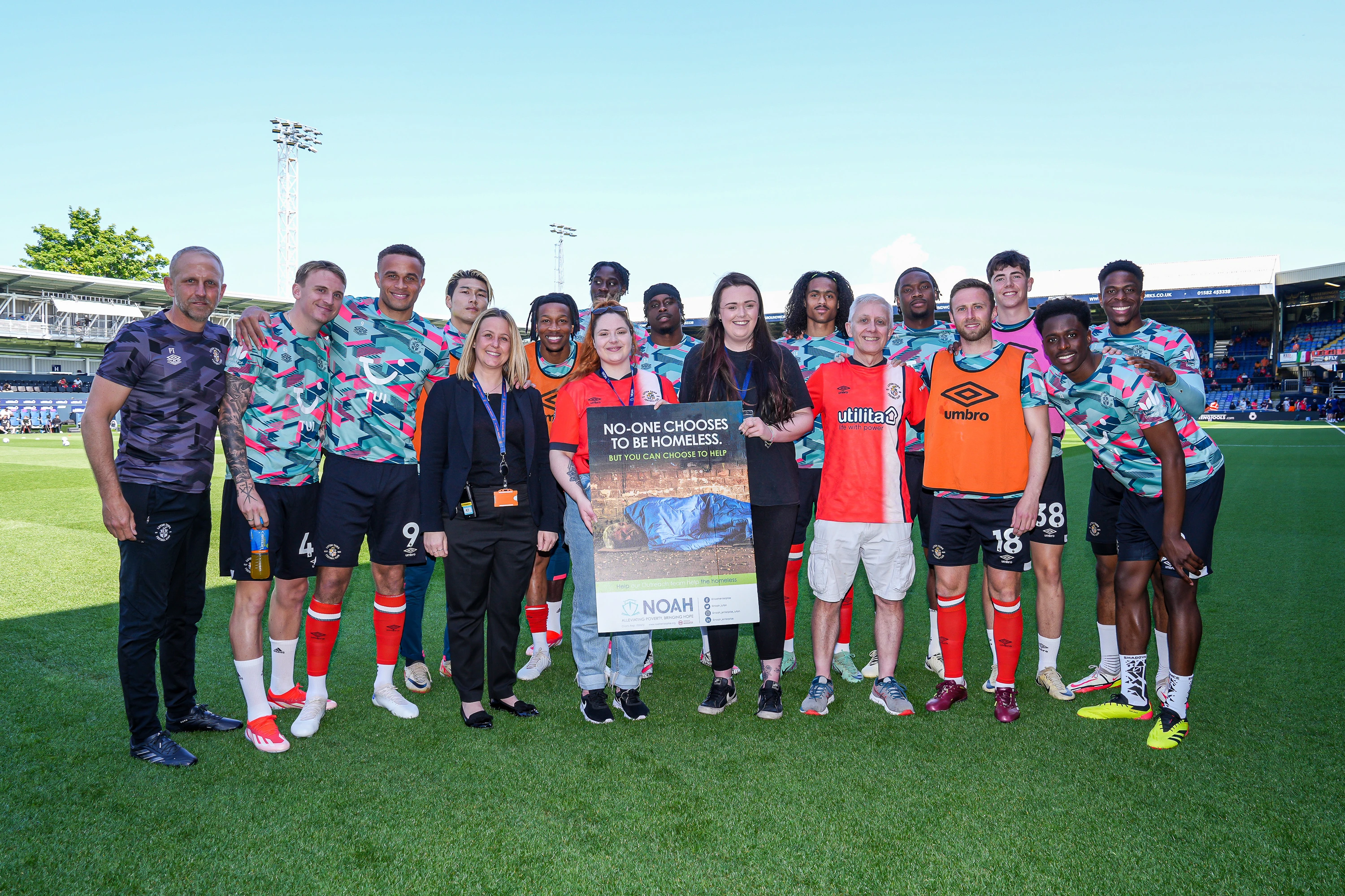 Club Charity of the Year NOAH on pitch presentation with the Luton Town squad and staff.