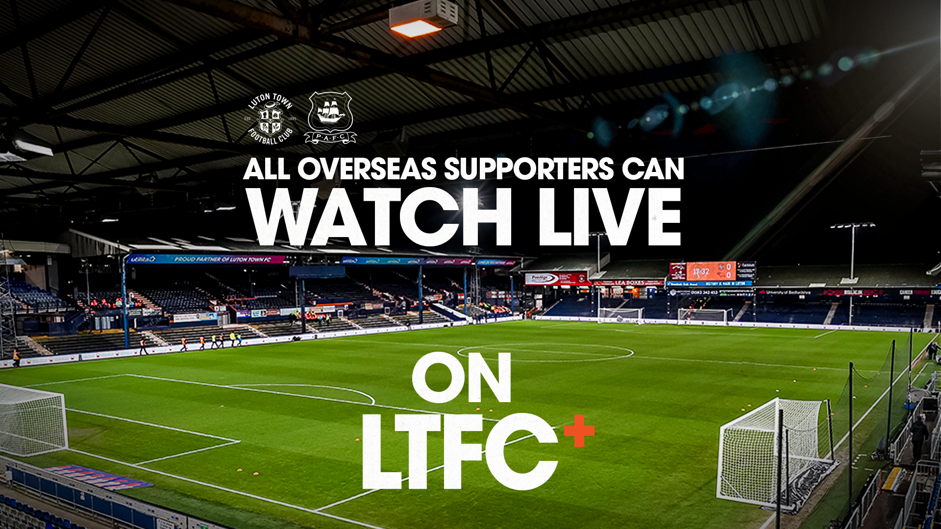 A graphic showing that LTFC+ subscribers based overseas can watch the Plymouth game set against a backdrop of Kenilworth Road at night.