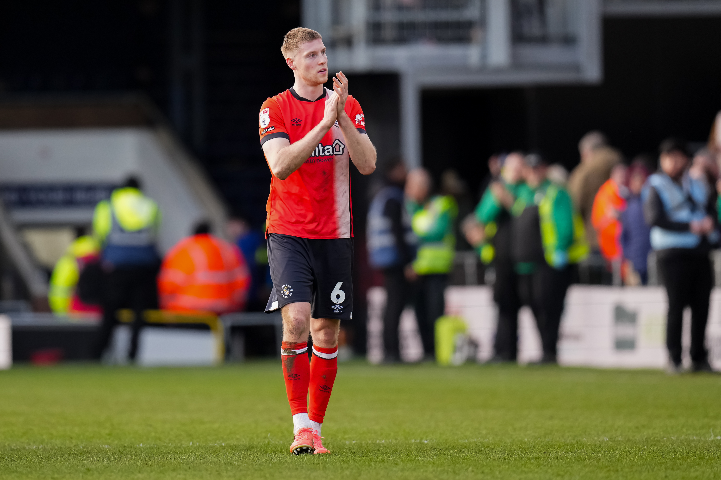 Mark McGuinness applauds the supporters after the Hatters' 1-0 home win over Portsmouth.