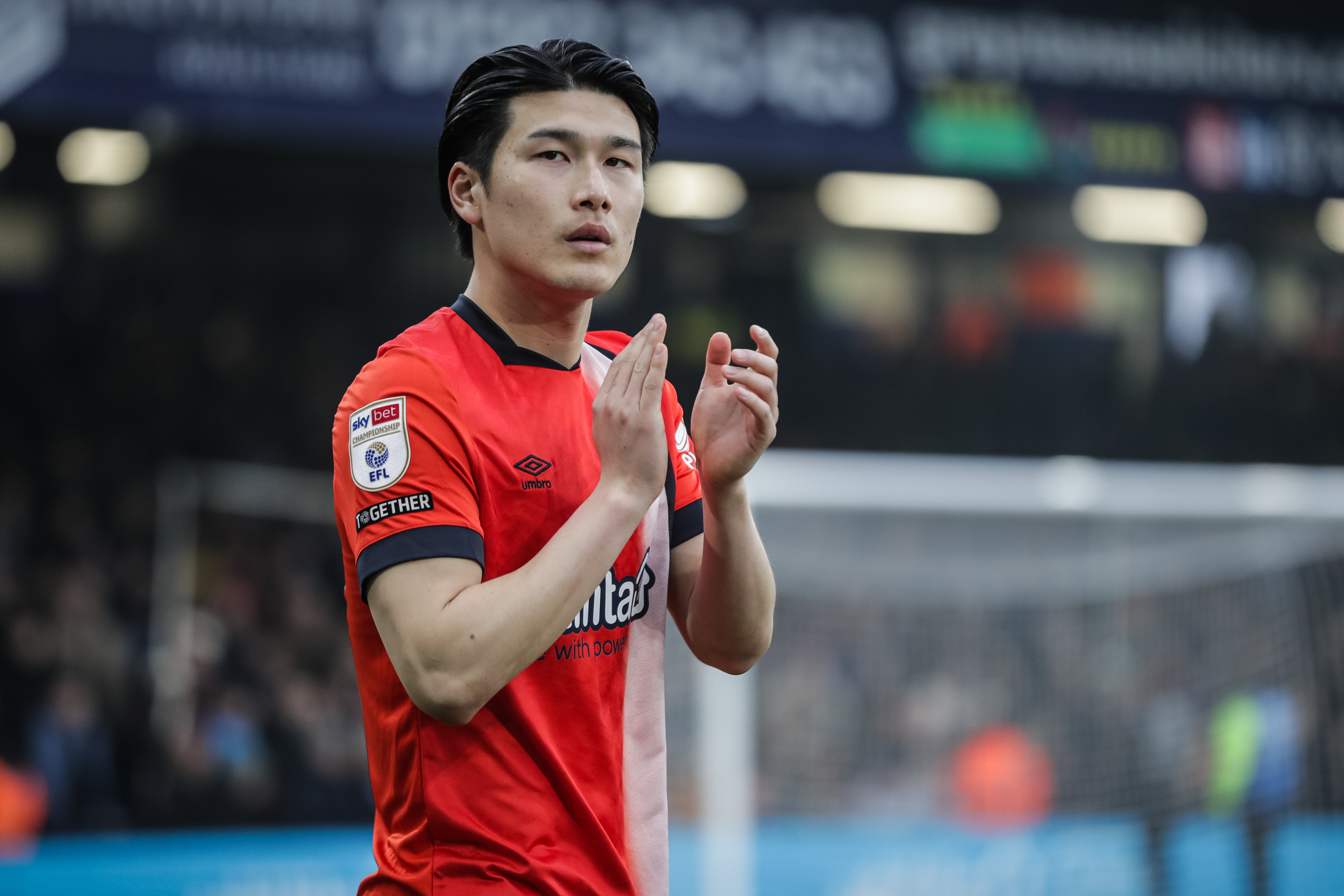 Daiki Hashioka applauds the Kenilworth Road crowd before kick-off against Preston.