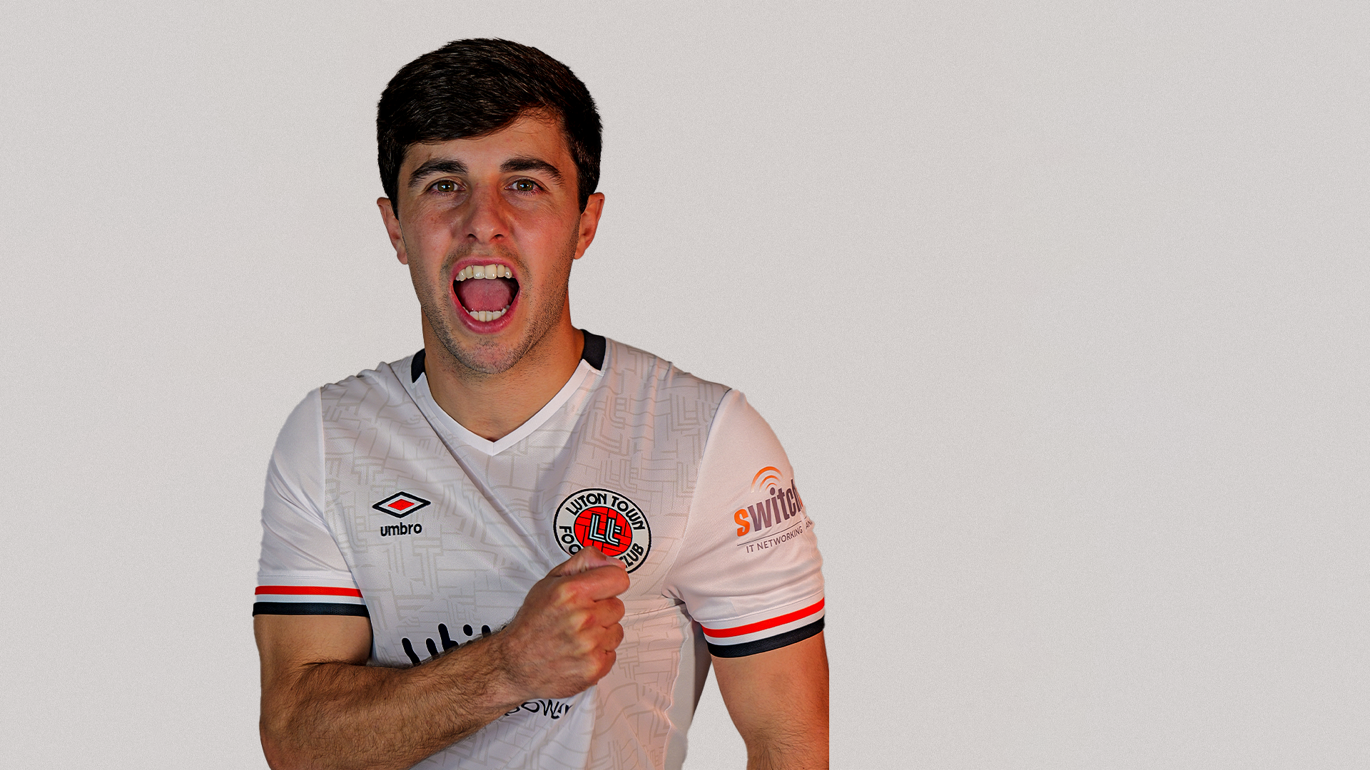 Liam Walsh wears the Hatters' white kit during his unveiling as a Luton Town player at The Brache