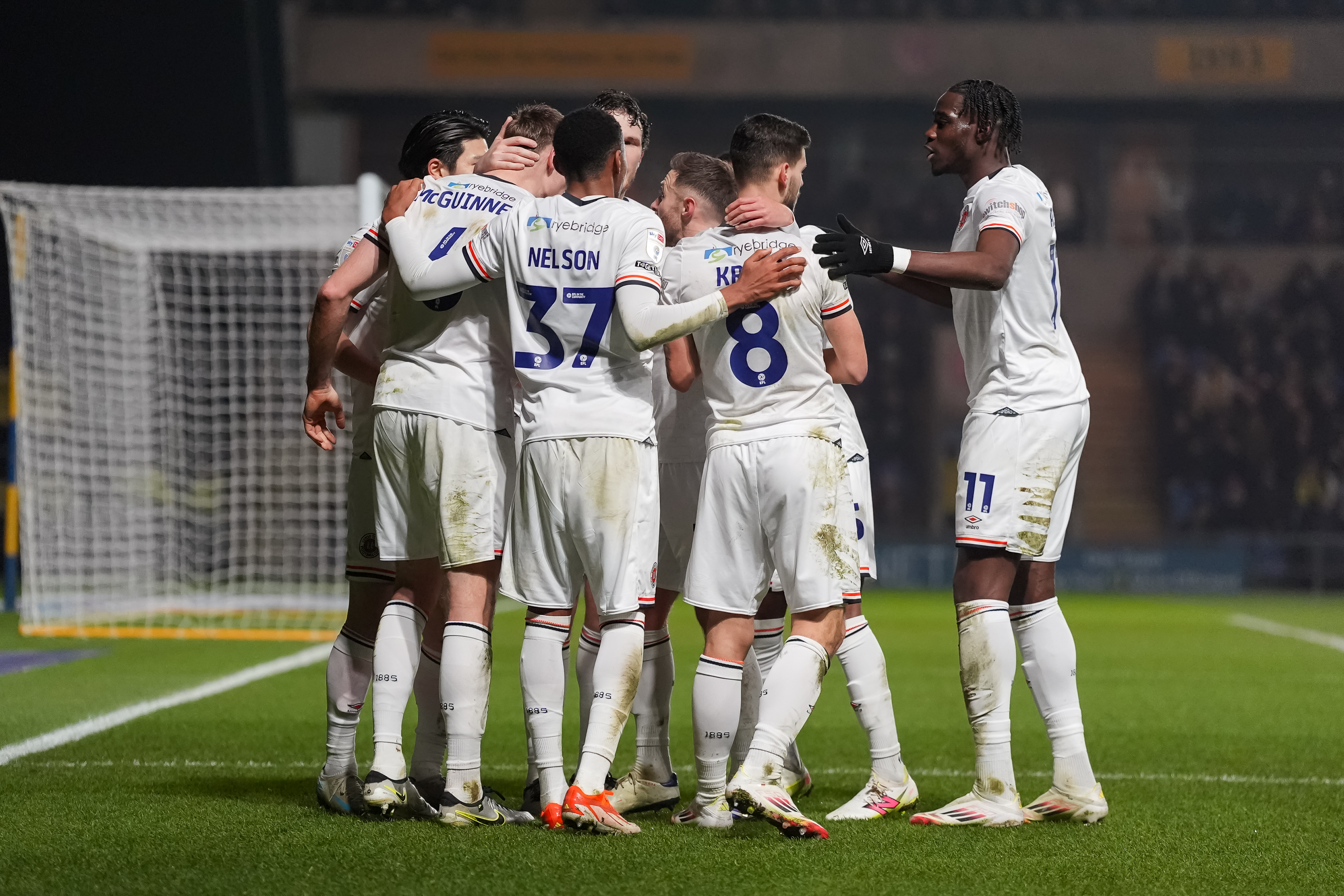 The Luton players celebrating Mark McGuinness' goal.