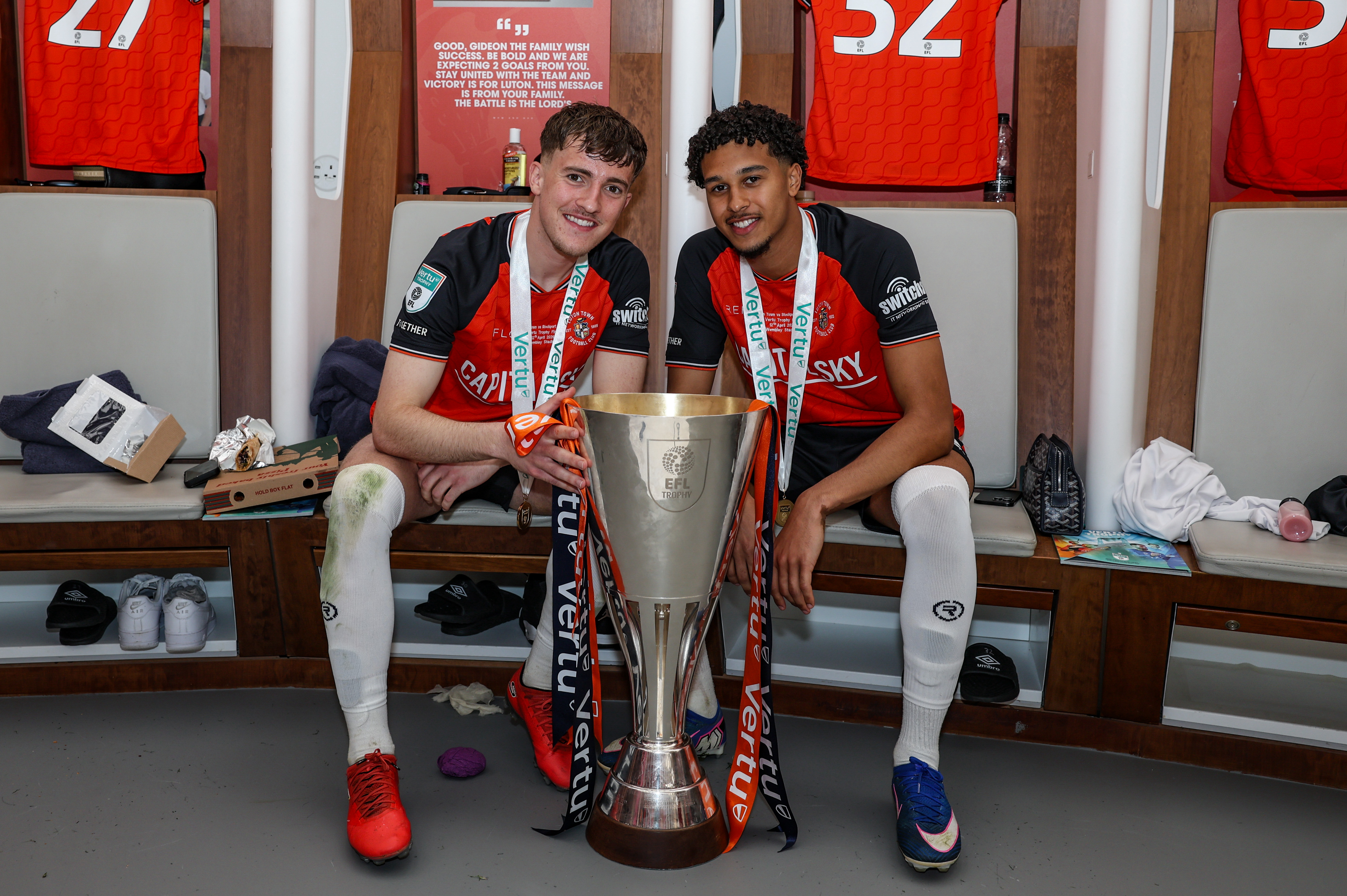 Jake Richards and Emilio Lawrence with the Vertu Trophy in the Wembley dressing room.