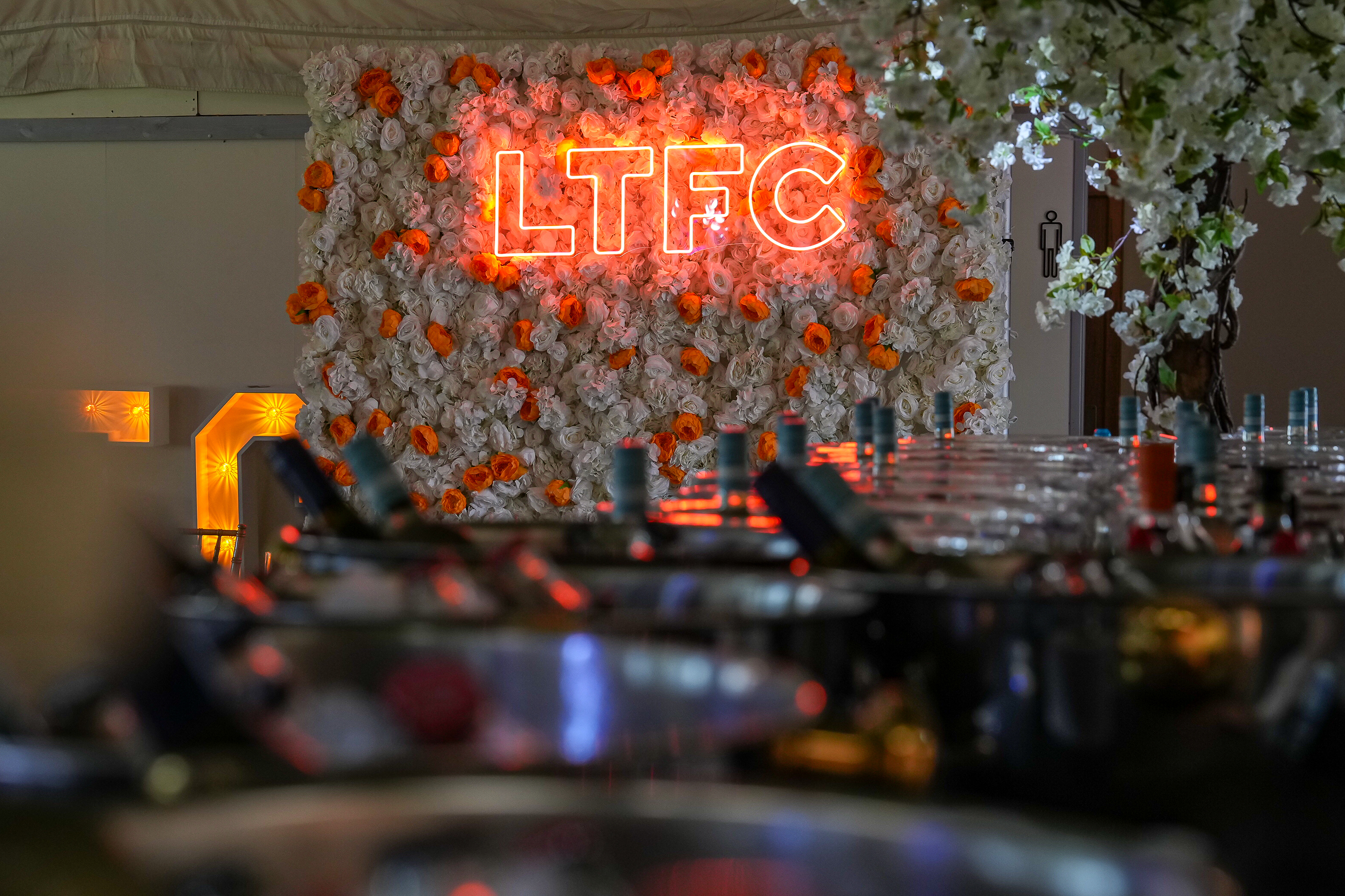 A picture of the flower wall with luminated LTFC lettering at the 2023/24 End of Season Dinner.