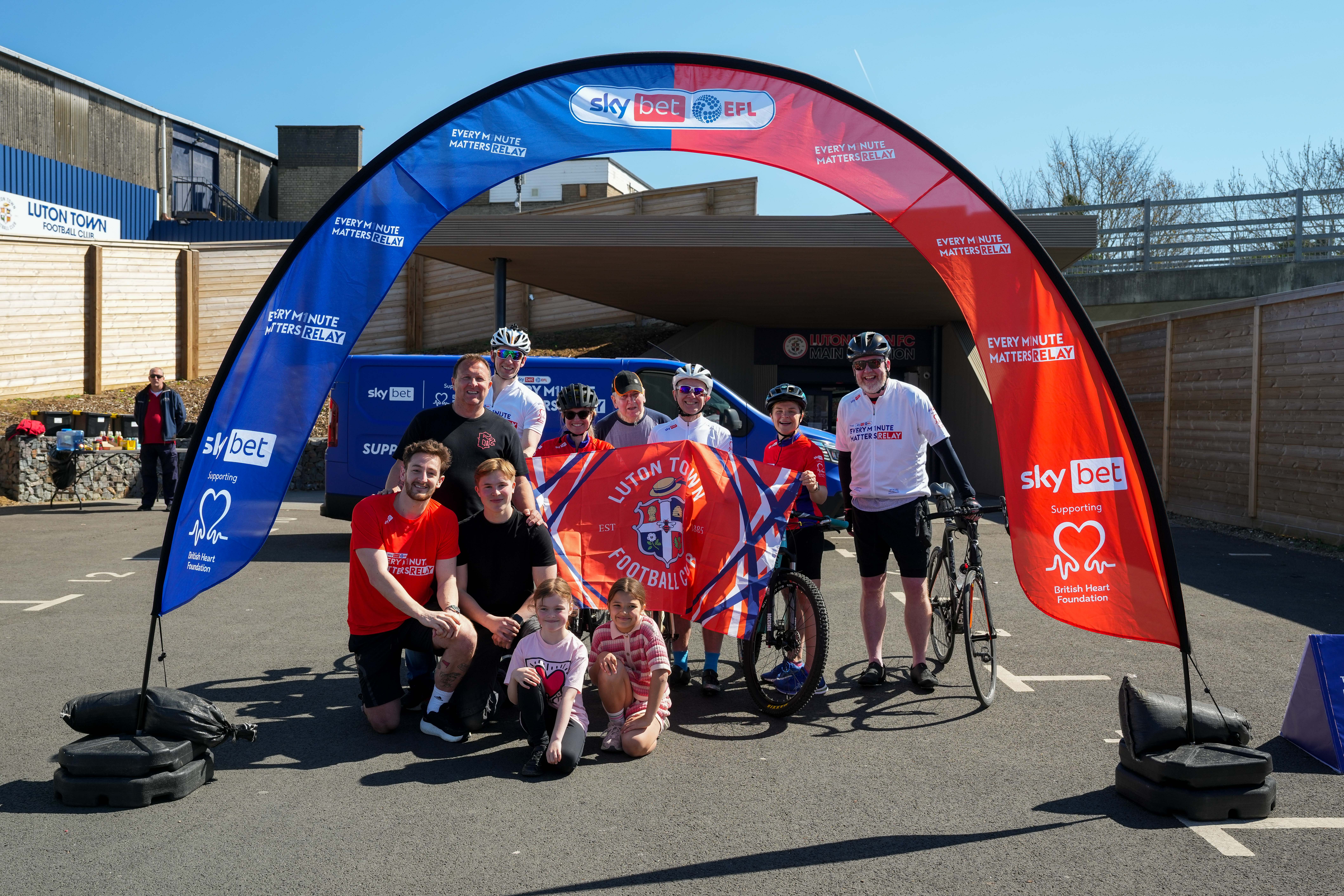 Tom Lockyer and the five Hatters cyclists prepare to set off for Stevenage.