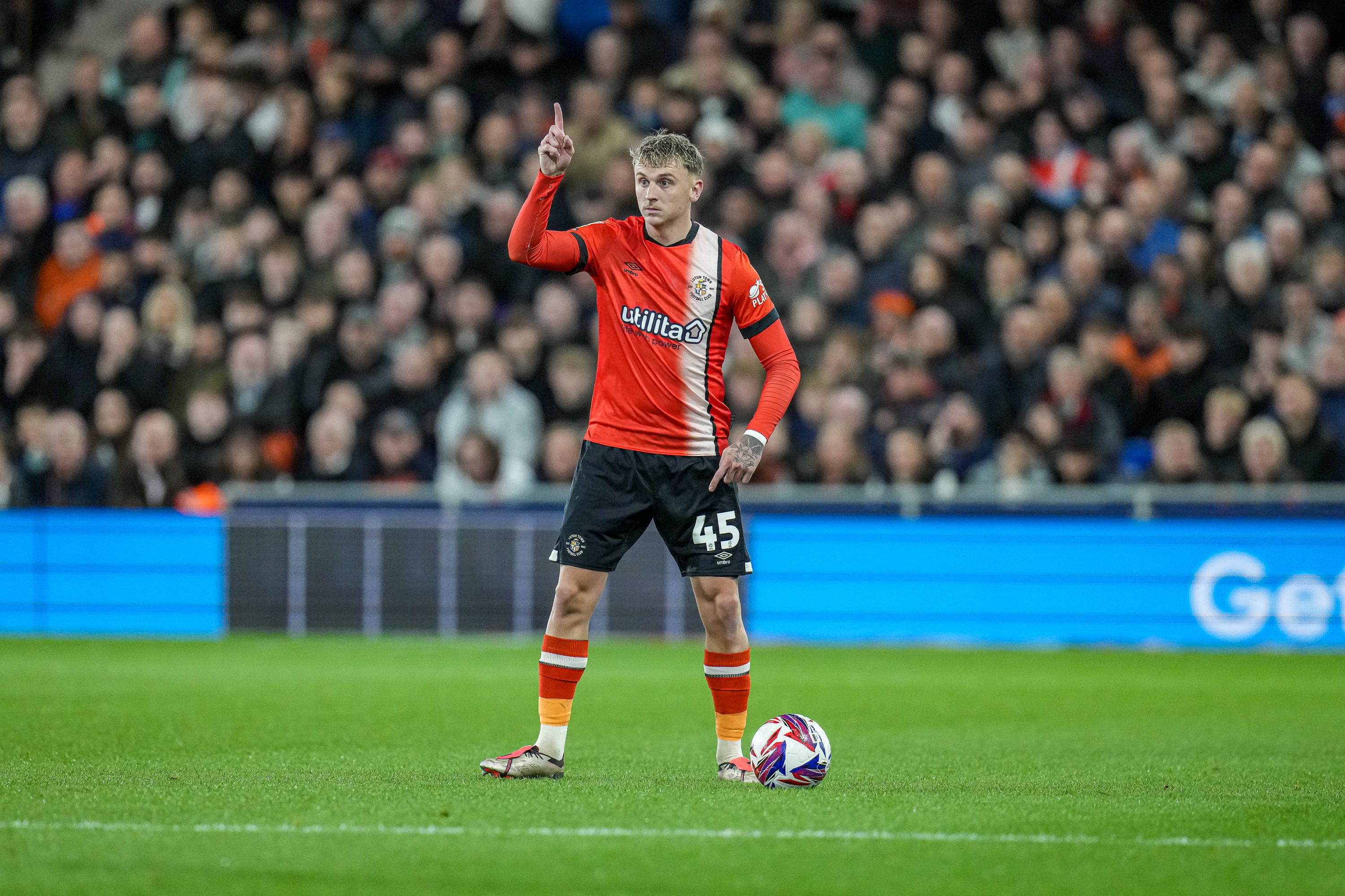 Alfie Doughty on the ball looking for a pass.