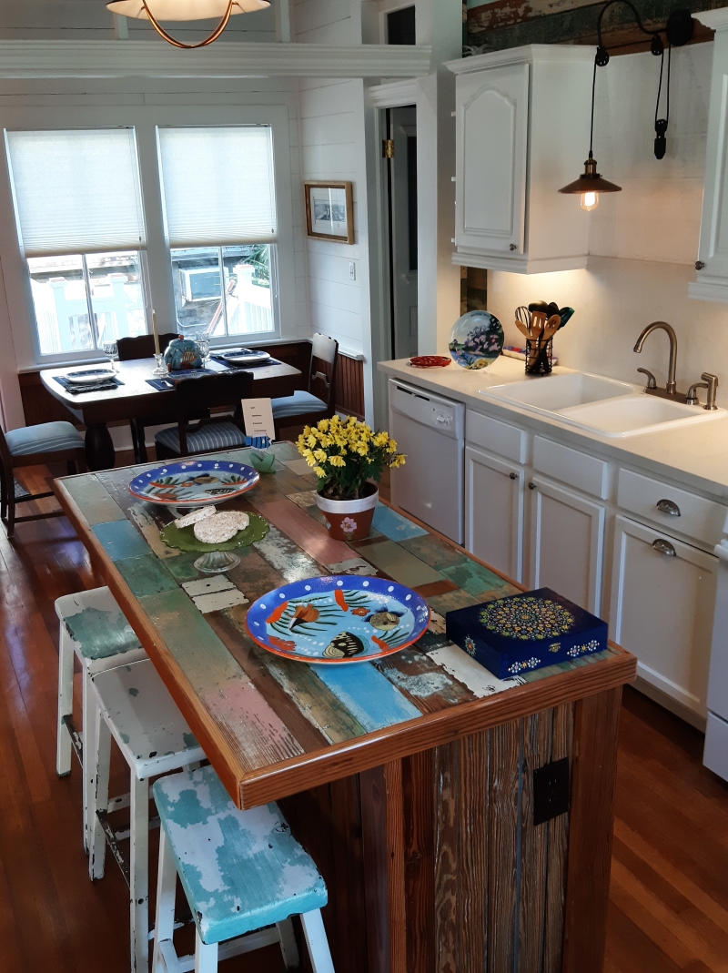 Open kitchen with a handmade island table
