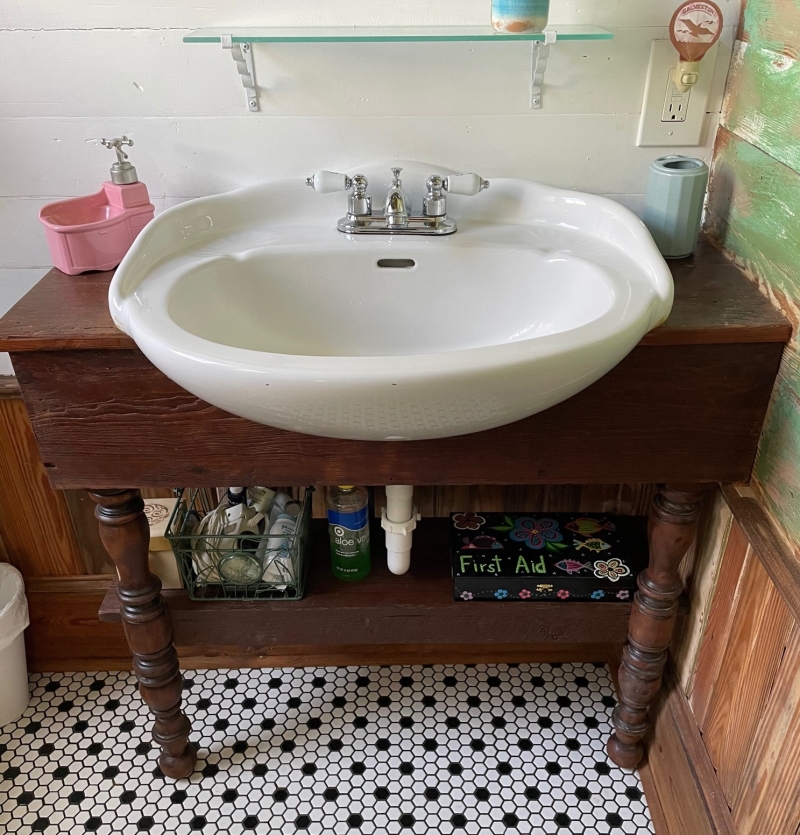 Handmade vanity and cabinet in the private second bathroom