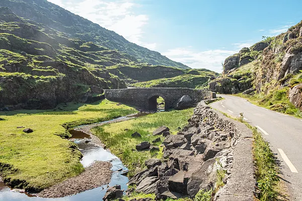 The old Wishing Bridge in green valley, Gap of Dunloe in Black Valley, Ring of Kerry, County Kerry, Ireland